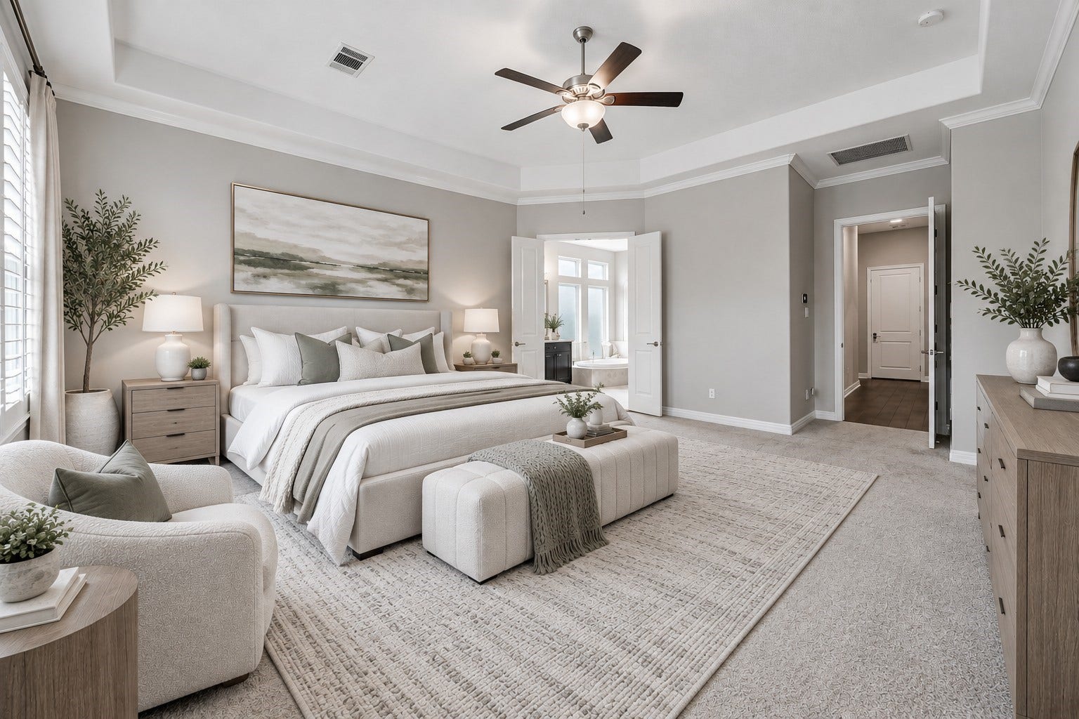Primary bedroom down with coffered ceilings, fan, crown molding and plantation shutters. (Virtually staged room)