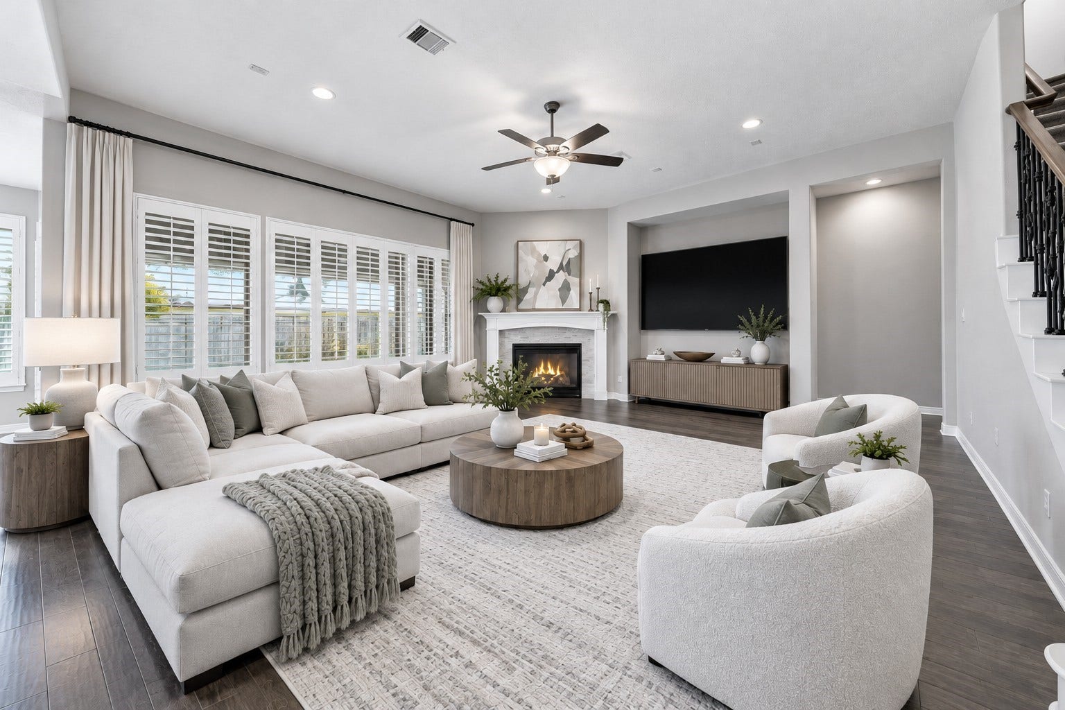 Welcoming family room with views of the backyard patio and pool. Gas log, remote fireplace, ceiling fan, and plantation shutters. (Virtually staged picture)