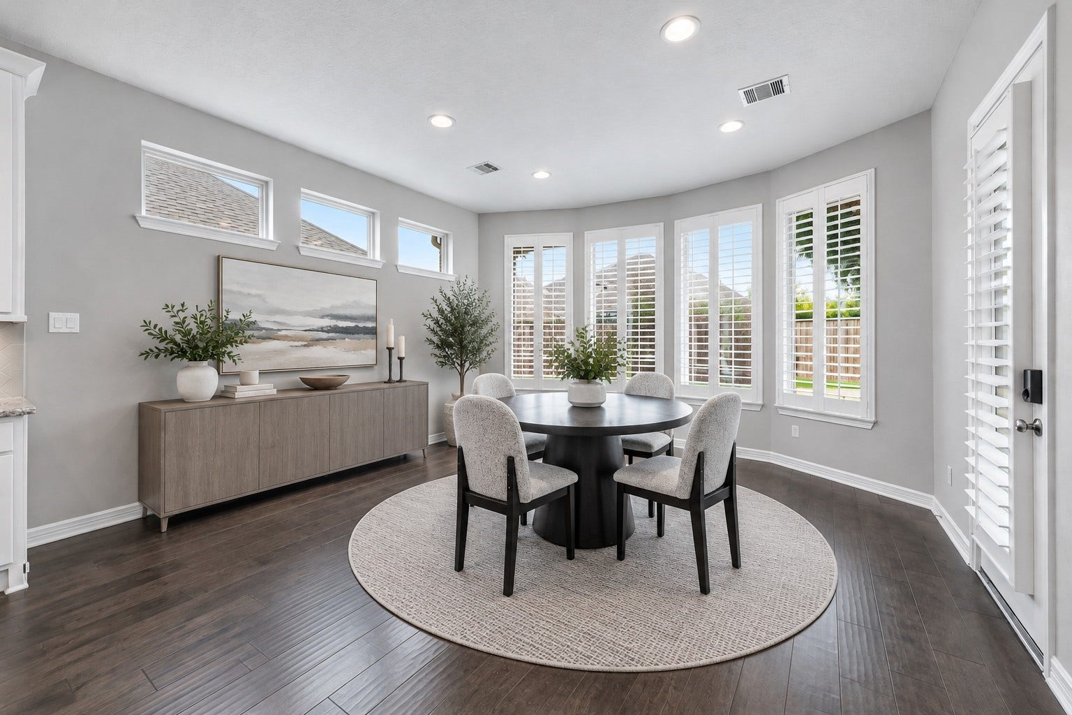 Large dining room has many possibilities for furniture and entertaining. Open to the kitchen with patio/pool views.  (Virtually staged picture.)
