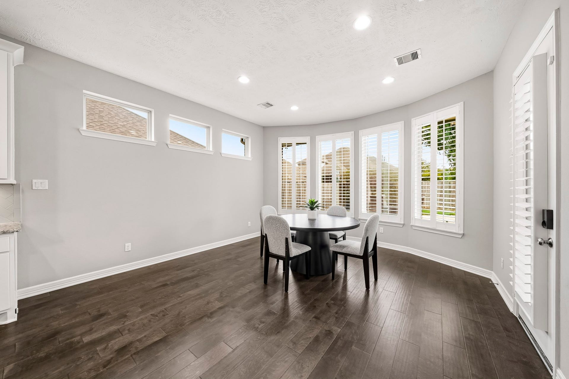 Tons of windows for natural lighting and plantation shutters