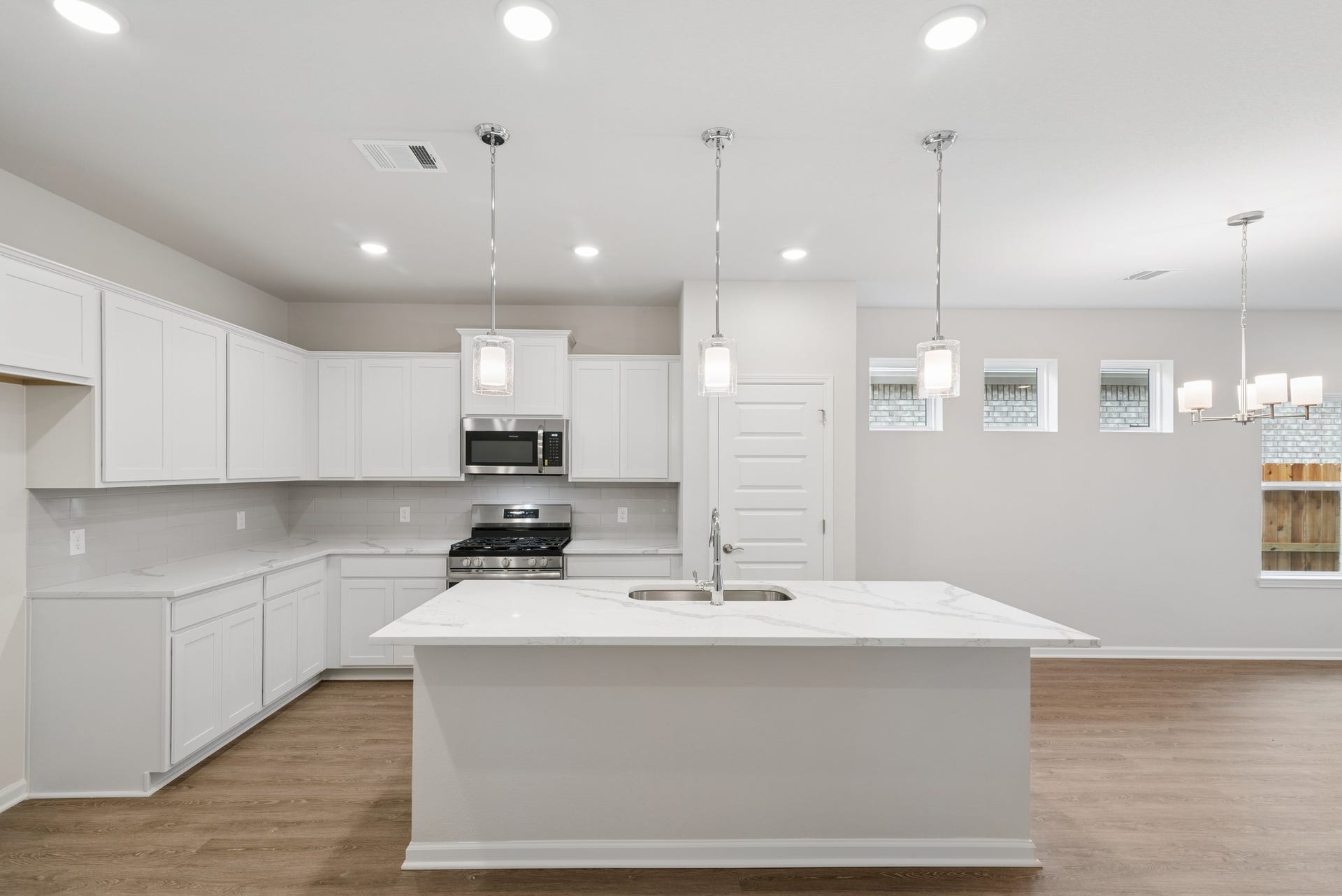 The Oakshire II- Kitchen with Island.  Sample image for illustration; upgrades, options, and colors may vary.