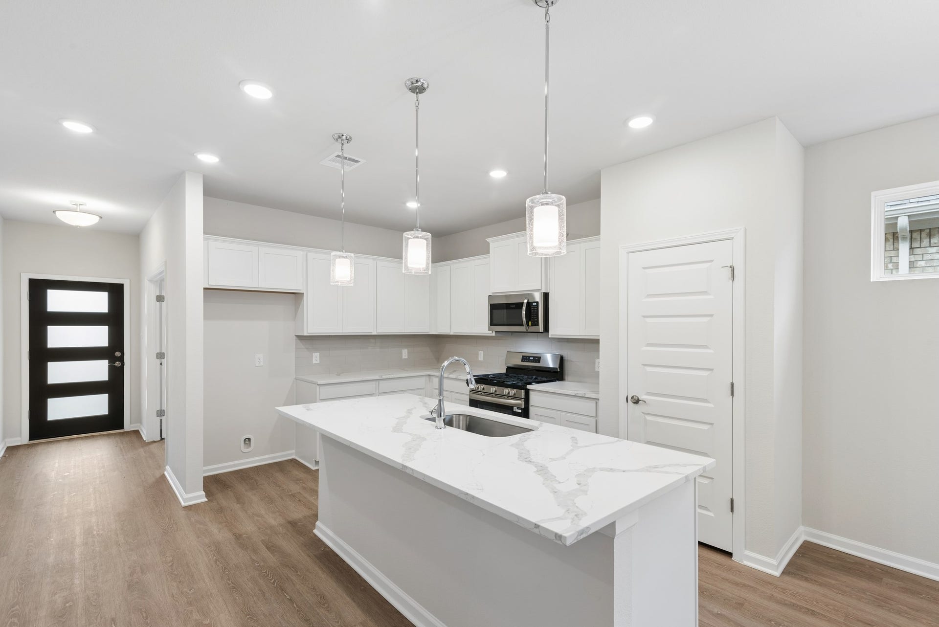 The Oakshire II- Kitchen with Island.  Sample image for illustration; upgrades, options, and colors may vary.