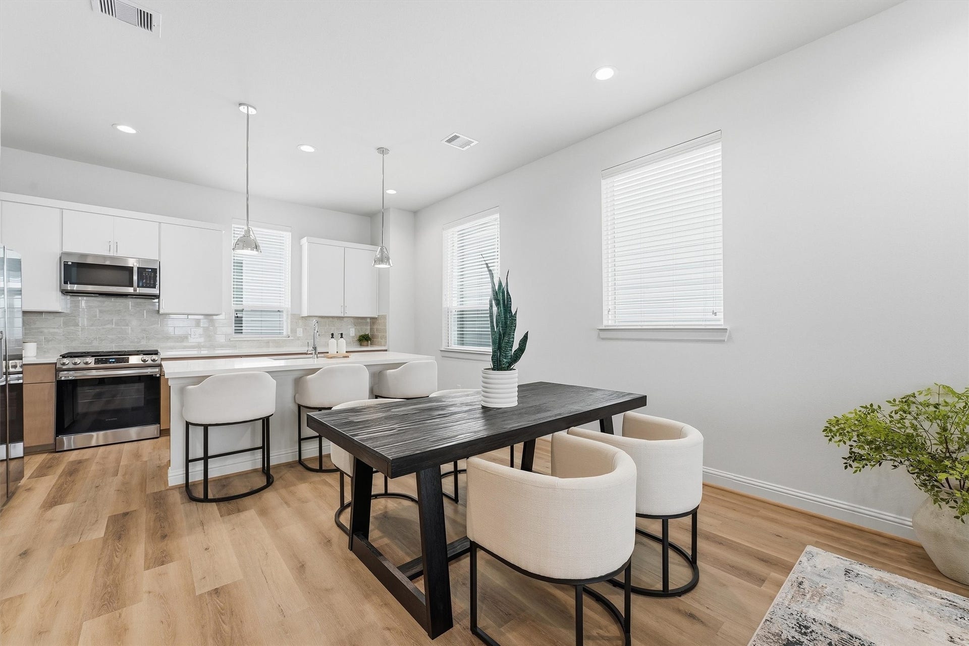 1804 Elysian Street, Houston, TX 77026 Discover seamless elegance in this open-concept space, where a modern kitchen with sleek finishes flows effortlessly into a cozy dining area perfect for entertaining.