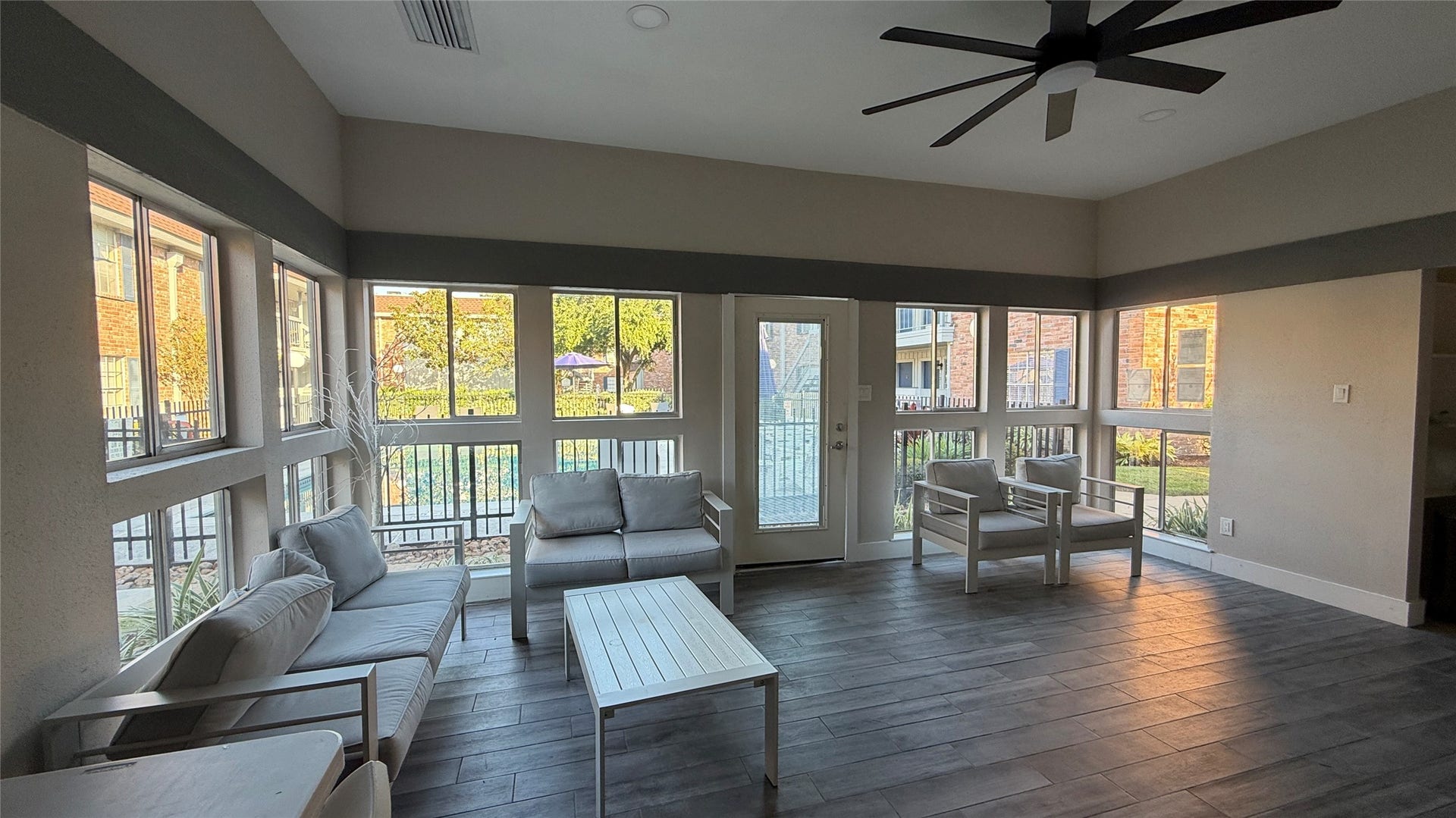 2250 Bering Drive, #40, Houston, TX 77057 Welcoming clubhouse gathering space featuring abundant windows, comfortable seating, and views of the landscaped grounds.