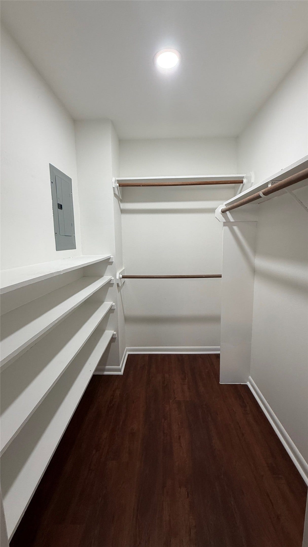 2250 Bering Drive, #40, Houston, TX 77057 Spacious walk-in closet featuring built-in shelving and multiple hanging areas for organized storage.