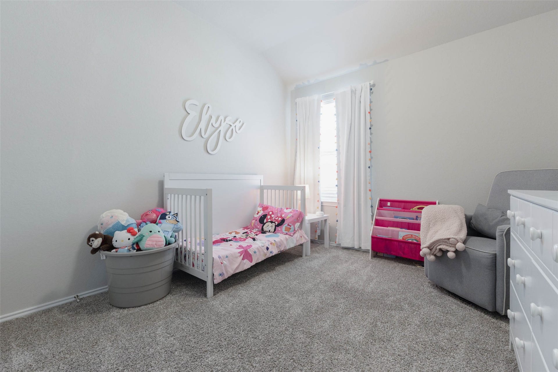 15303 Dinnet Berm Drive, Humble, TX 77346 Guest bedroom number three rounds out the home with cushy carpet and a soothing wall color. A window brightens the room with daylight, and the layout adapts easily to a nursery, a child's room, or extra guest space.