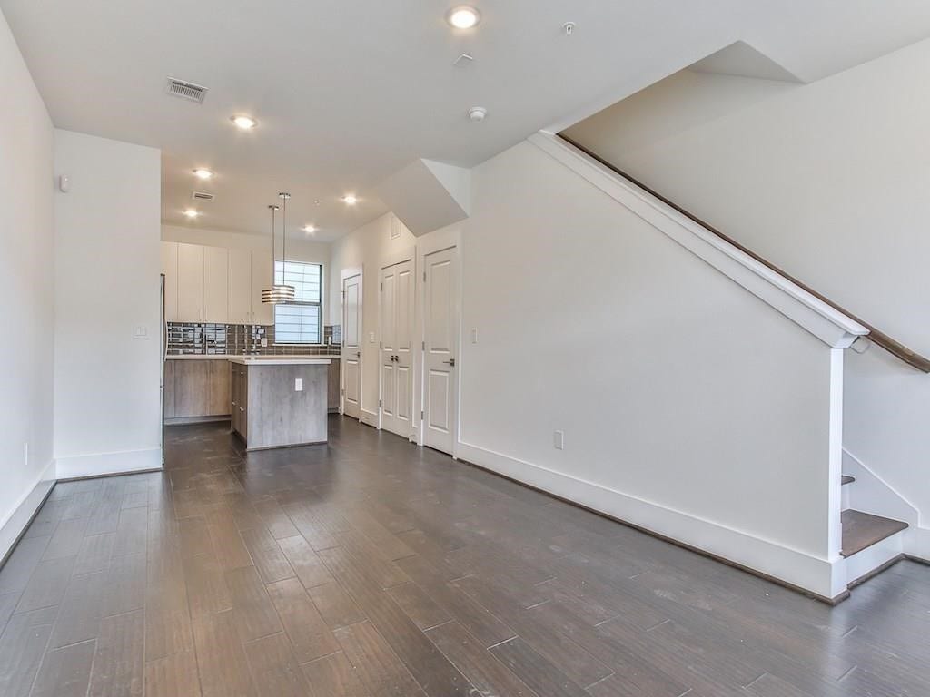 2401 Crawford Street, #A-213, Houston, TX 77004 Wood- look floors throughout the home