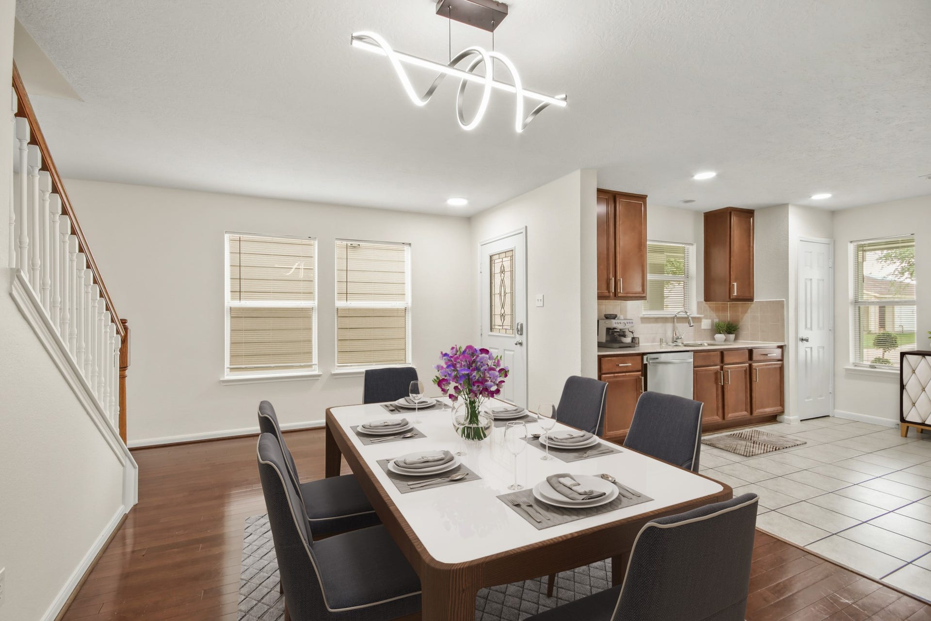 255 Silky Leaf Drive, Houston, TX 77073 Virtually Staged: Beautiful dining area featuring a unique pendant lighting, wood floors, direct access to the kitchen perfect for entertaining.
