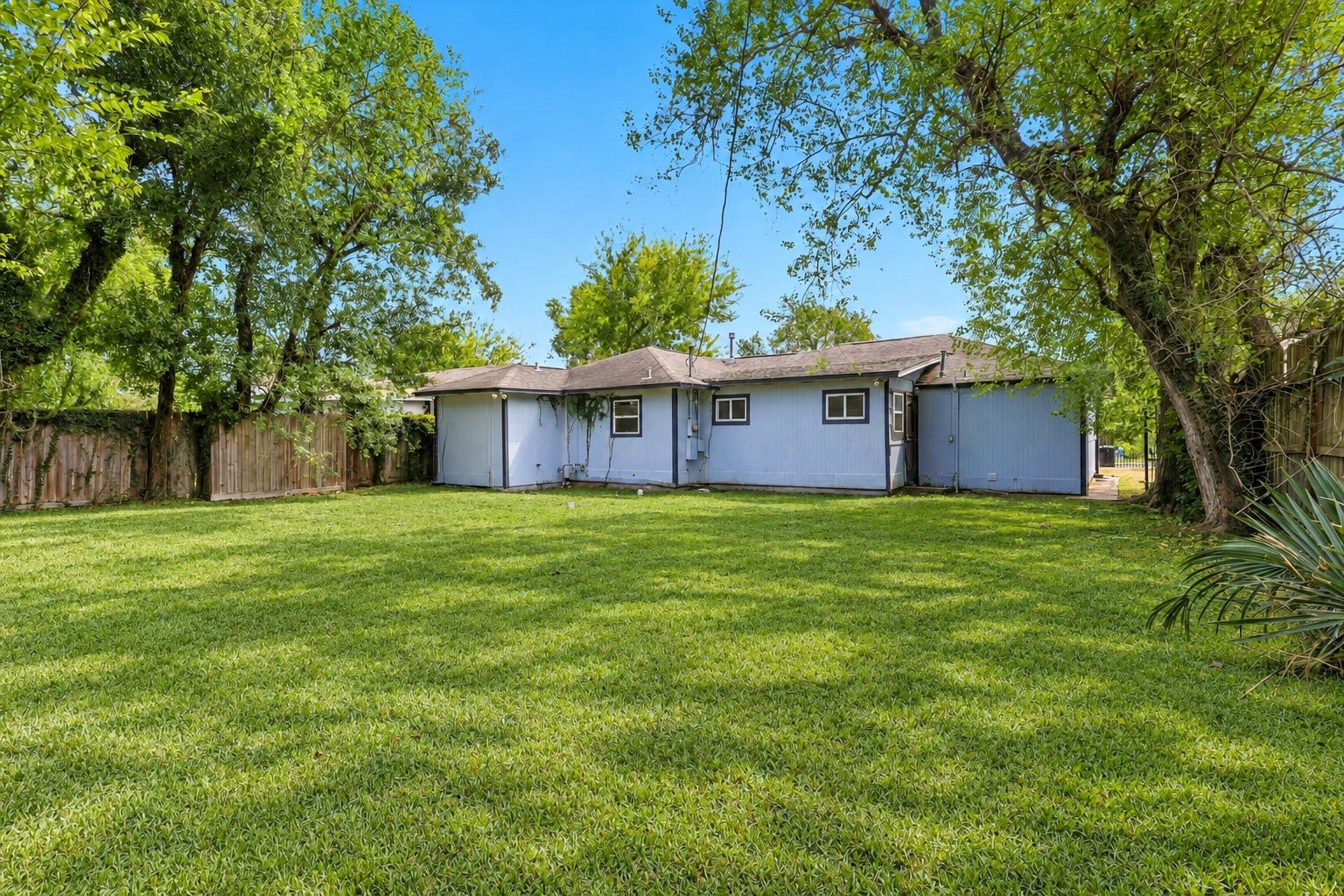Here's even more to love about this property! The spacious backyard offers a generous grassy area, mature trees, and a fully fenced setting for added privacy. Imagine weekend barbecues, outdoor games, or simply sitting back and enjoying your own little slice of the outdoors!