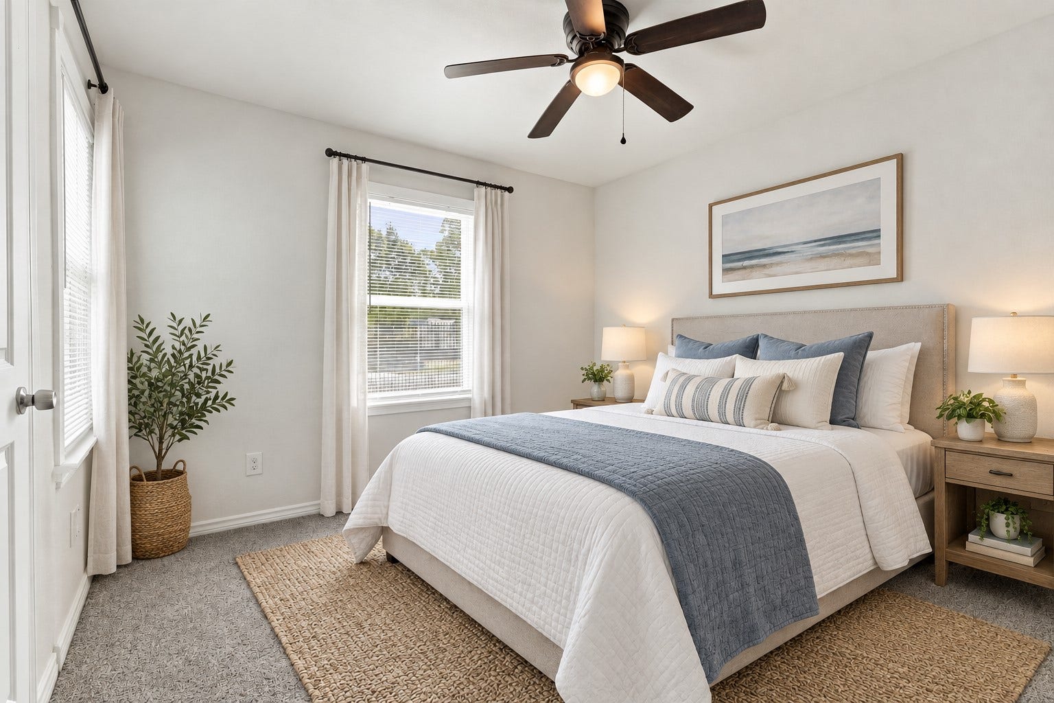 Your guests will feel right at home in this welcoming bedroom! Featuring soft carpeting, a ceiling fan, and a bright window, this comfortable space is beautifully staged with warm accents and inviting furnishings. A lovely spot for overnight visitors or another member of the family. *Virtually Staged*