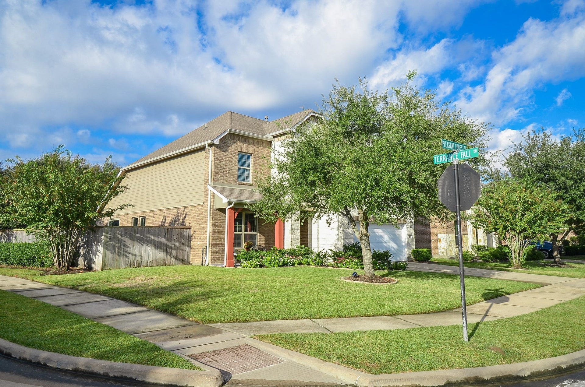 28503 Pleasant Forest Drive, Katy, TX 77494 Desirable corner lot offering extra yard space and attractive curb appeal.