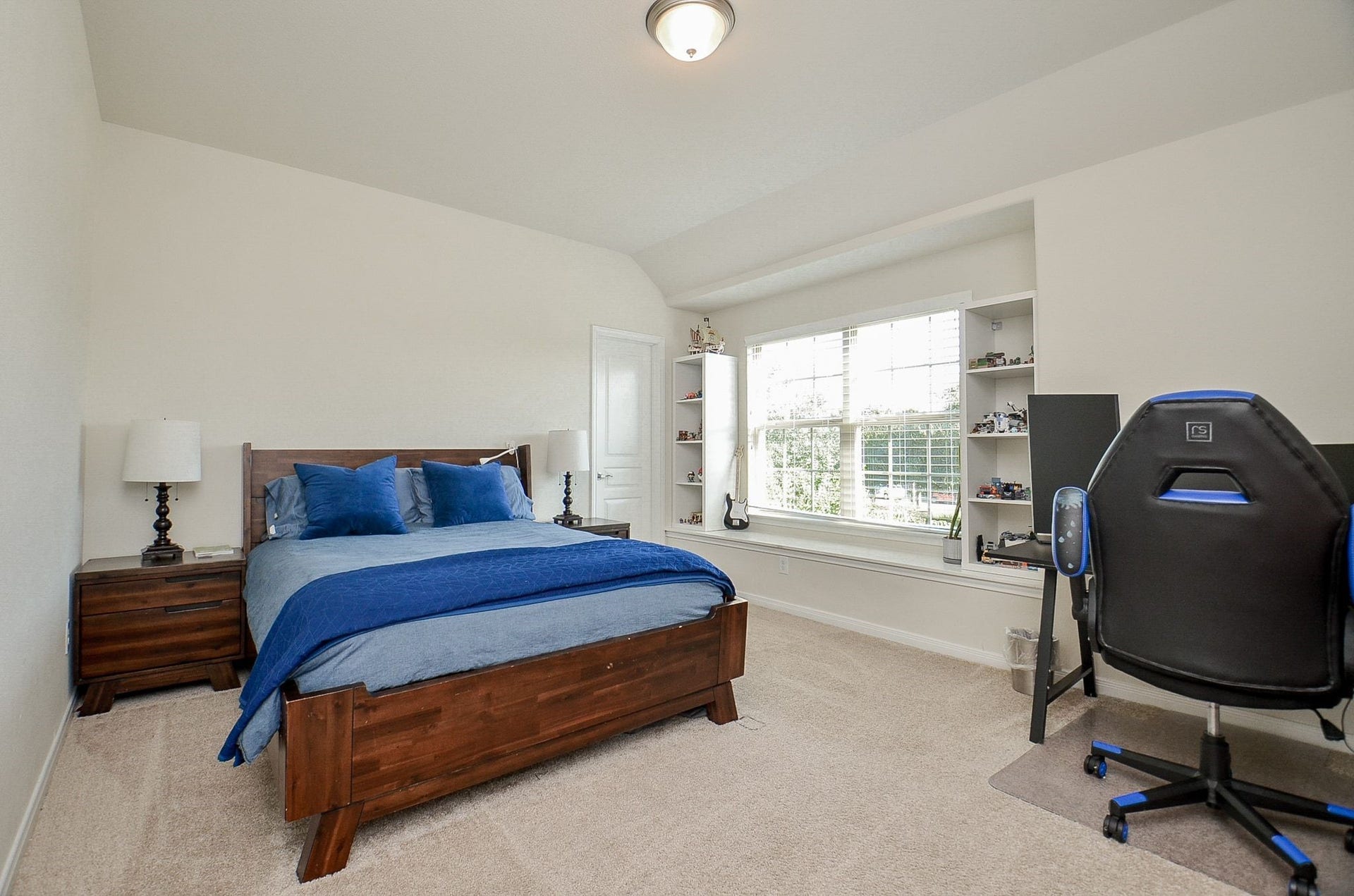 28503 Pleasant Forest Drive, Katy, TX 77494 Another bright secondary bedroom with a charming window seat and space for a desk.