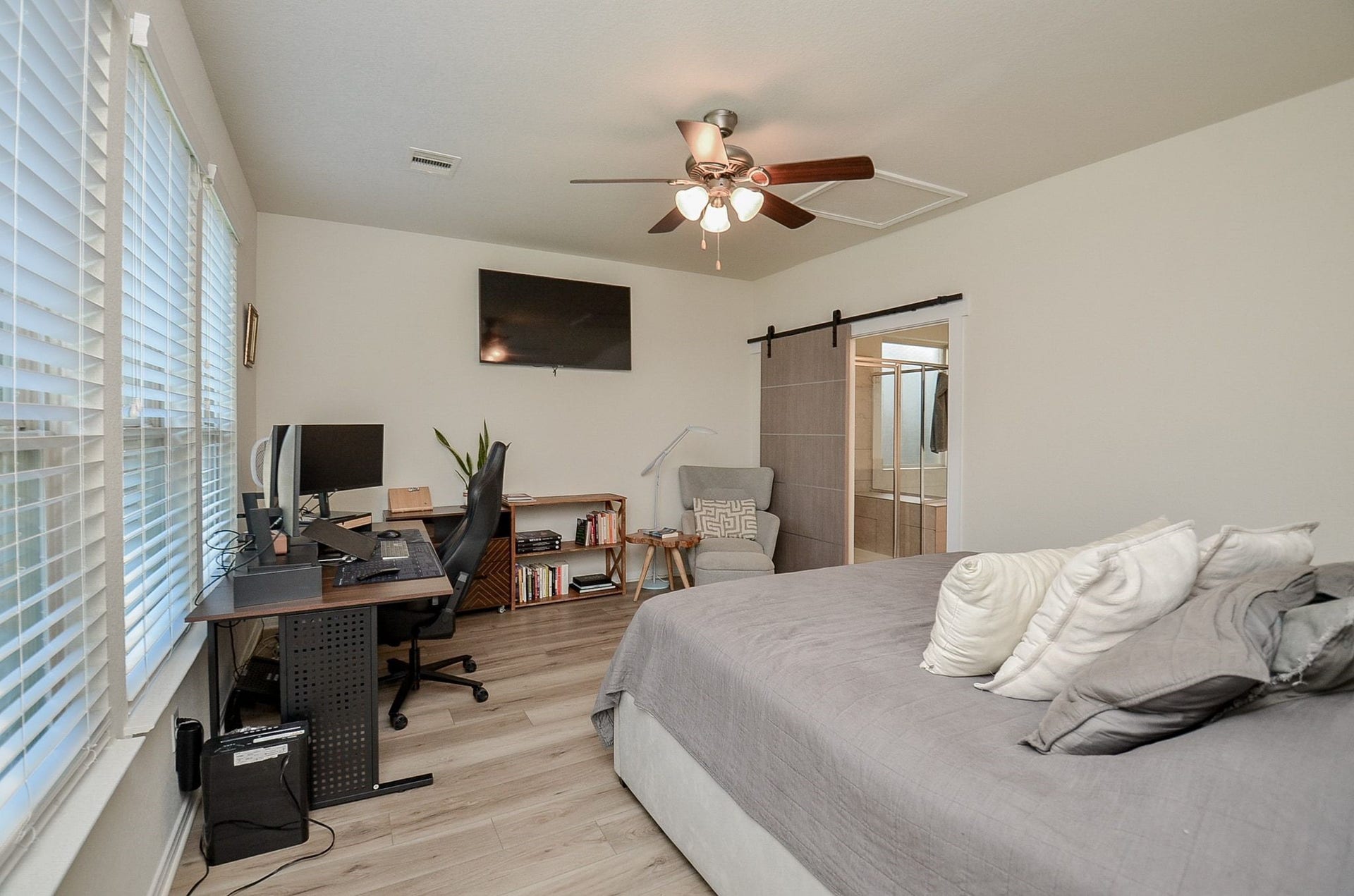 28503 Pleasant Forest Drive, Katy, TX 77494 Spacious primary bedroom with abundant natural light and room for a sitting area or a home office.