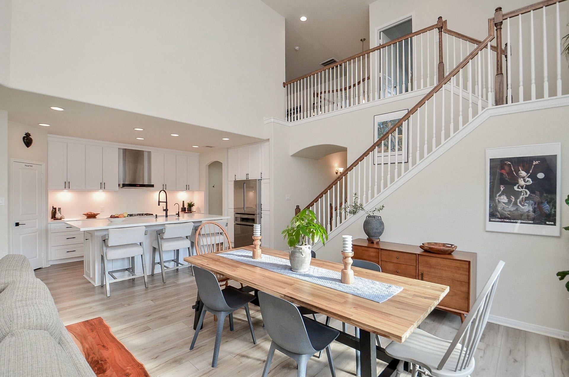 28503 Pleasant Forest Drive, Katy, TX 77494 Overview of dining and kitchen with impressive two-story ceilings.