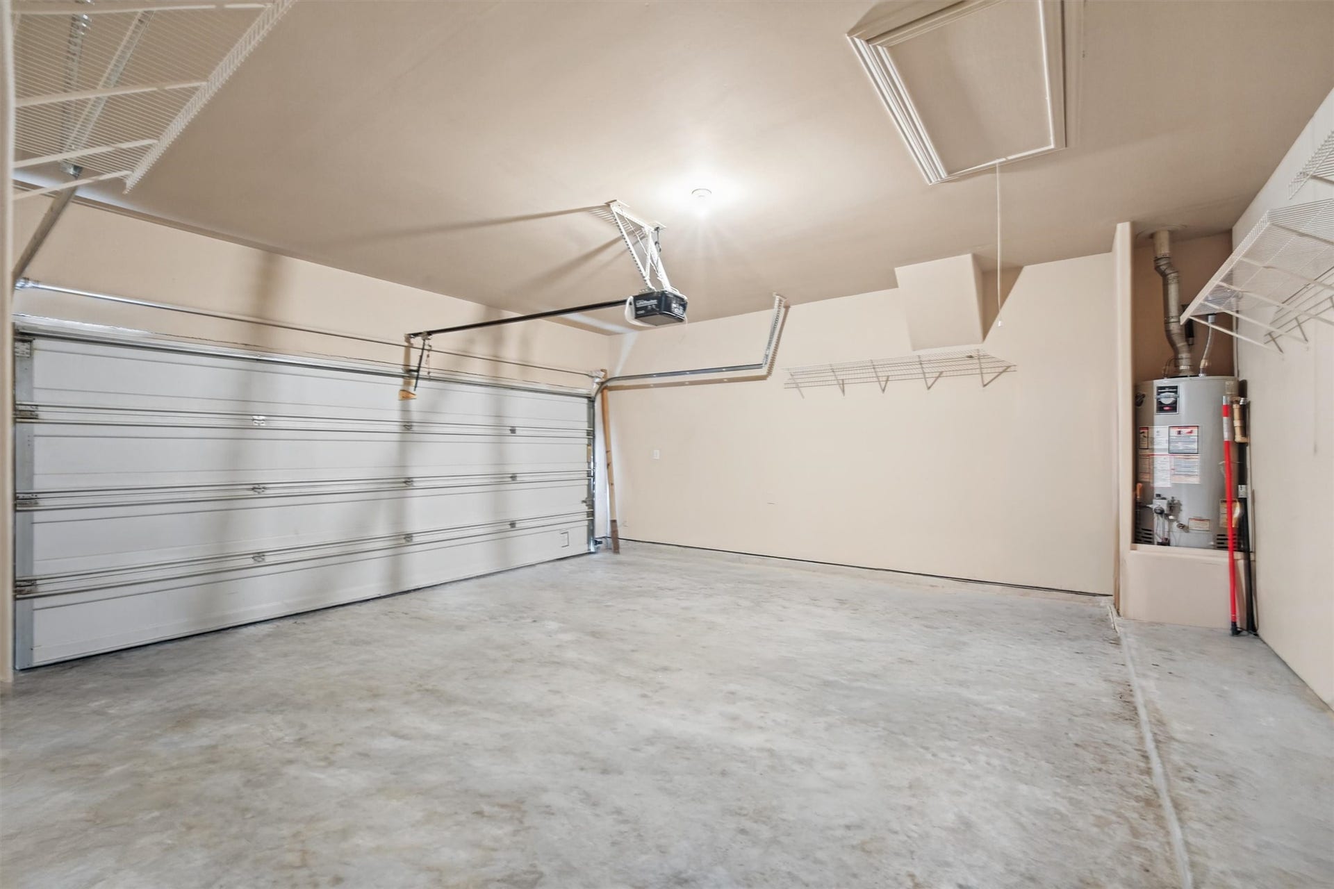 Large 2 door garage with plenty  of room for shelves and storage.