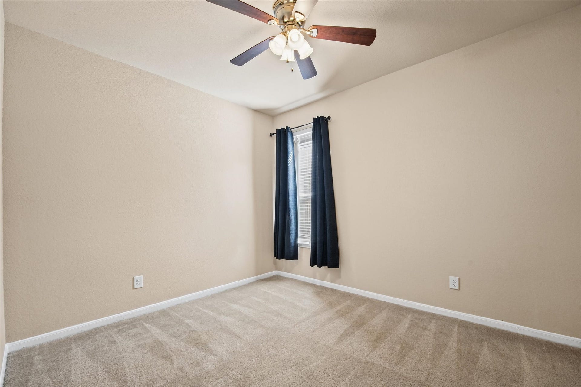Bedroom 4- carpeted and blackout curtains.