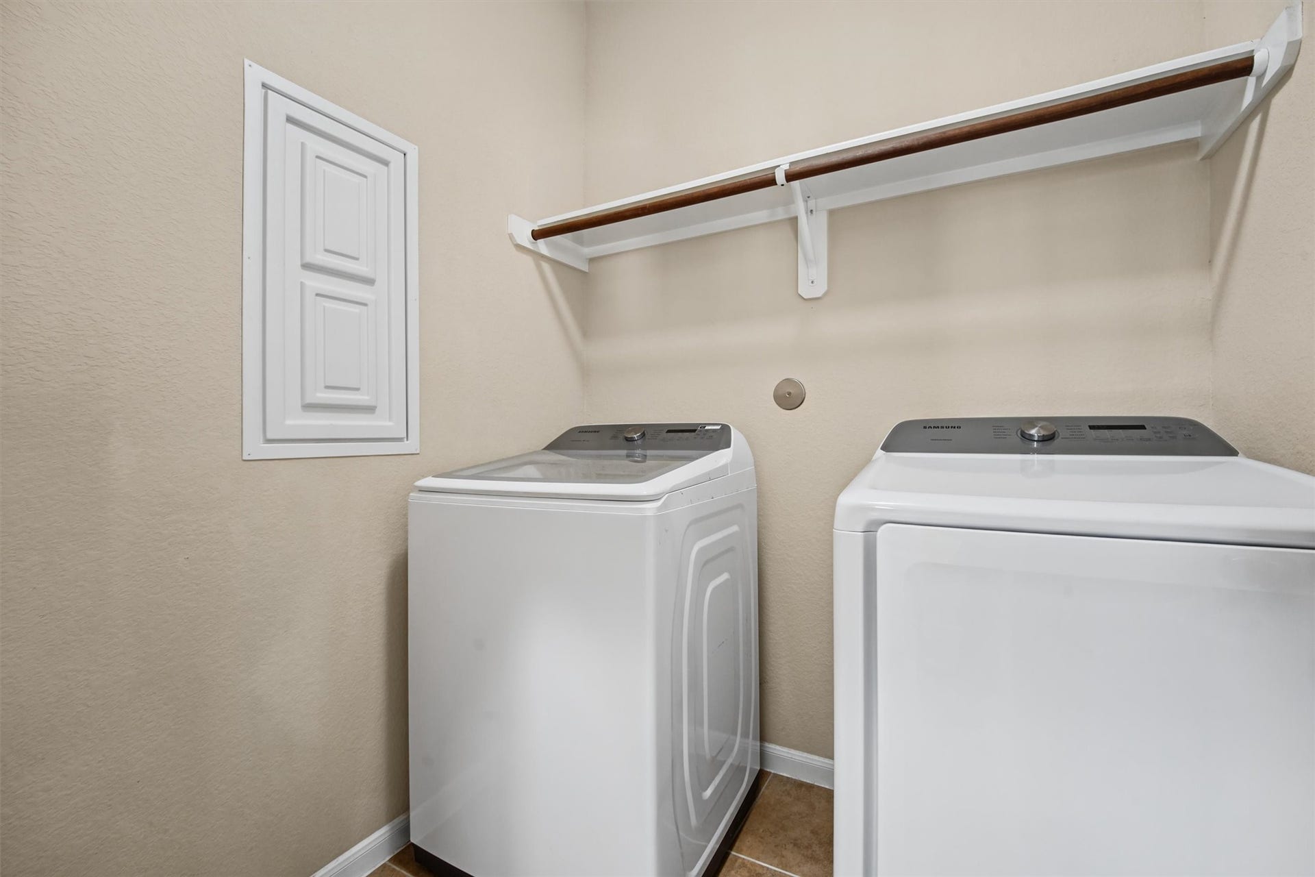 Large utility room located right across from primary bedroom.  Washer and dryer stays!