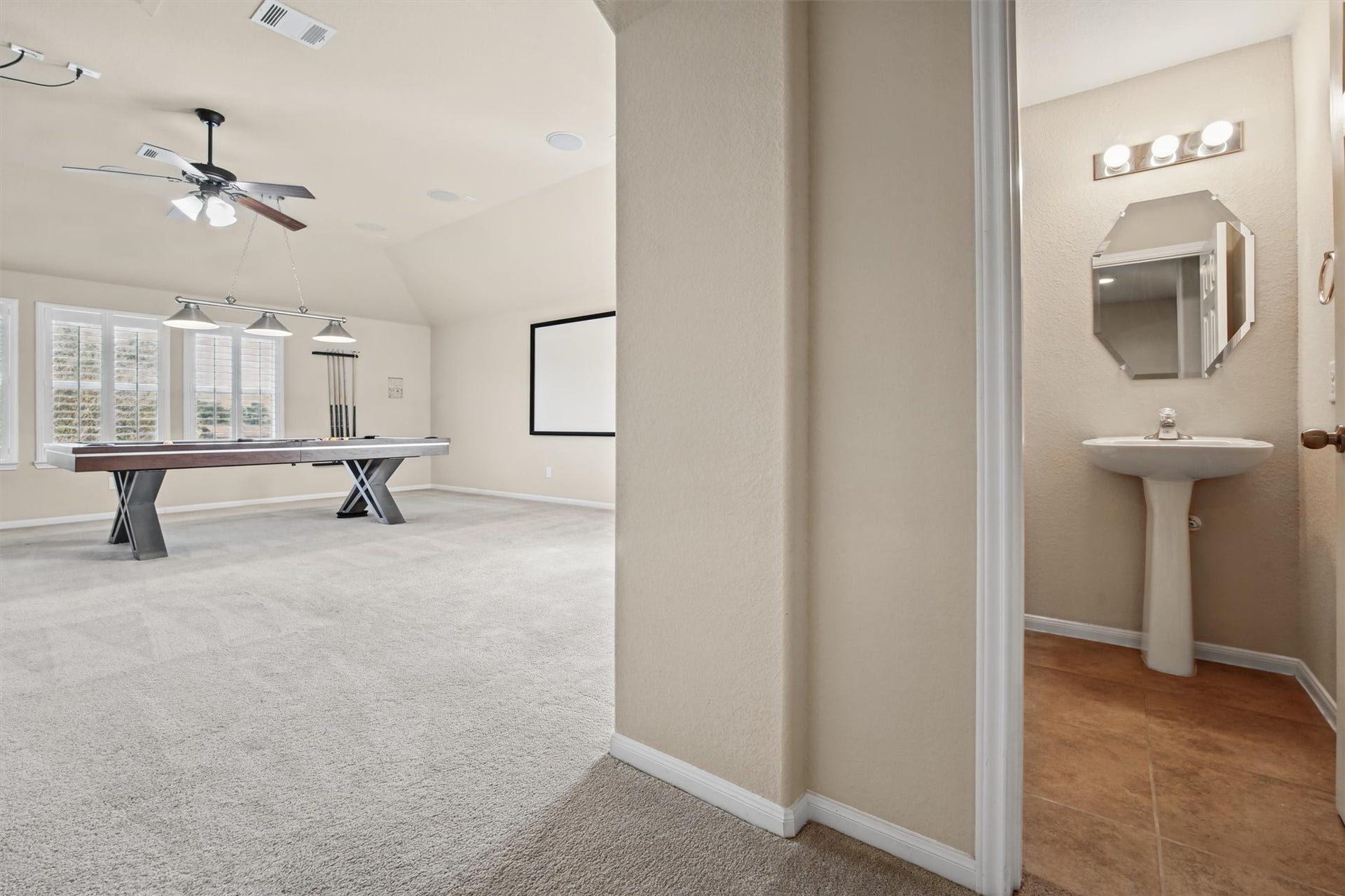 Upstairs- 1/2 bath at top of stairs before entering huge 600+ sq. ft flex space.