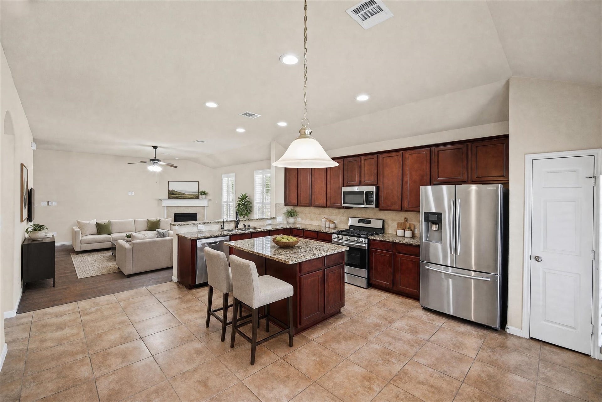 Another view of kitchen and den.  Pantry is off to the right.  Refrigerator stays!