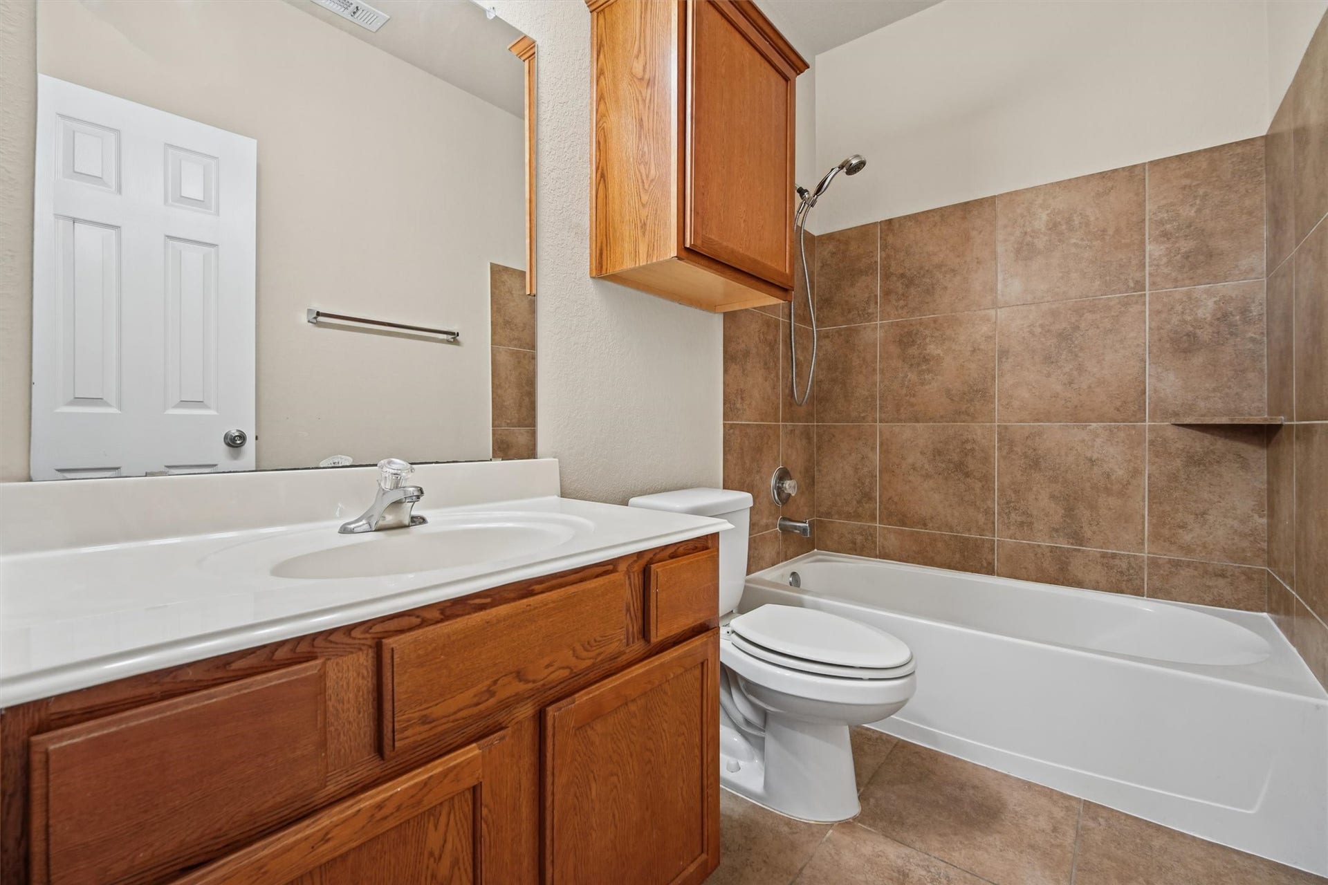 Full bath conveniently located in nook accommodating all secondary bedrooms- all conveniently located downstairs!