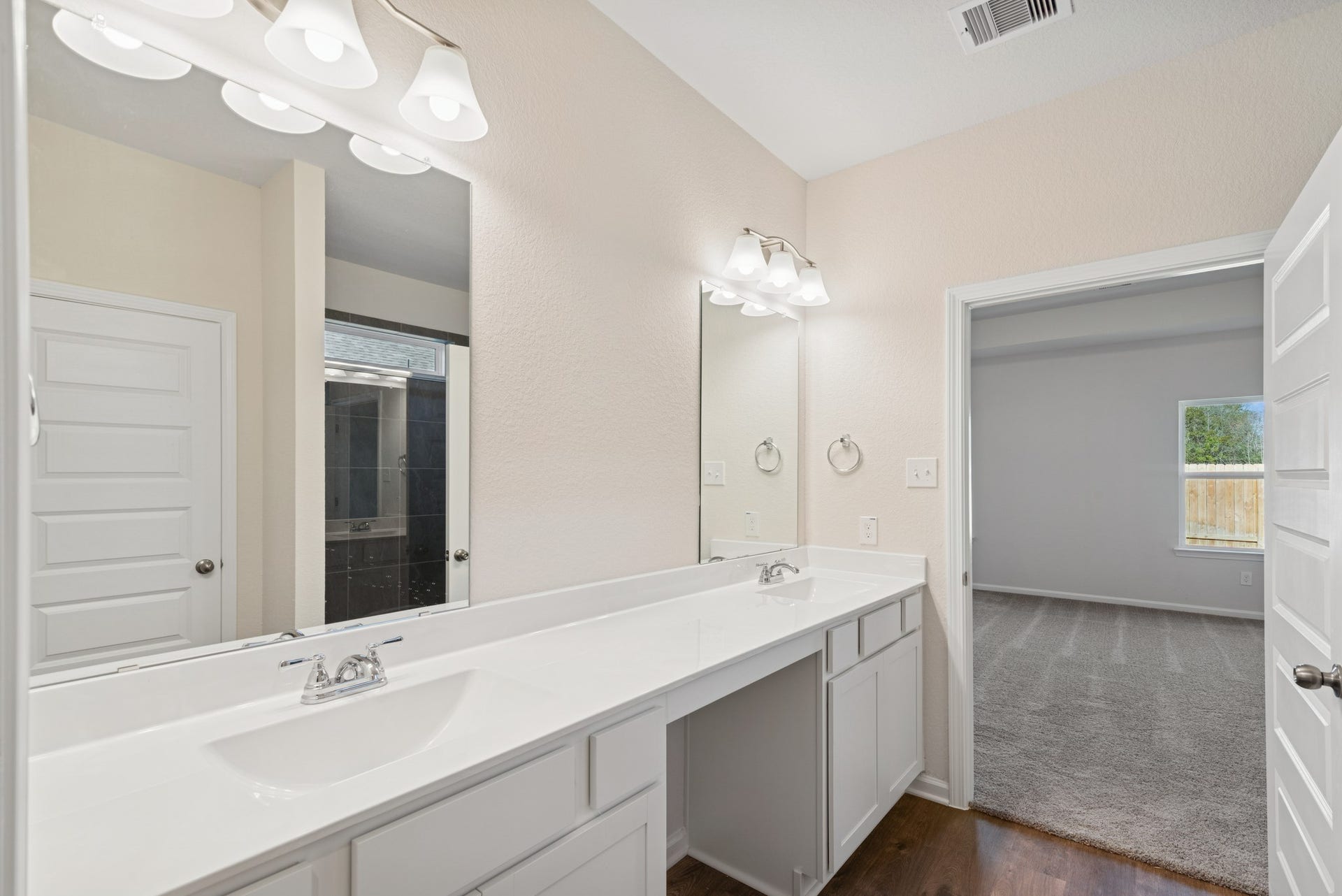 The Crawford- Primary Bath with Dual Vanities. Home under construction, sample photo used for illustrative purposes only, colors and options will vary.