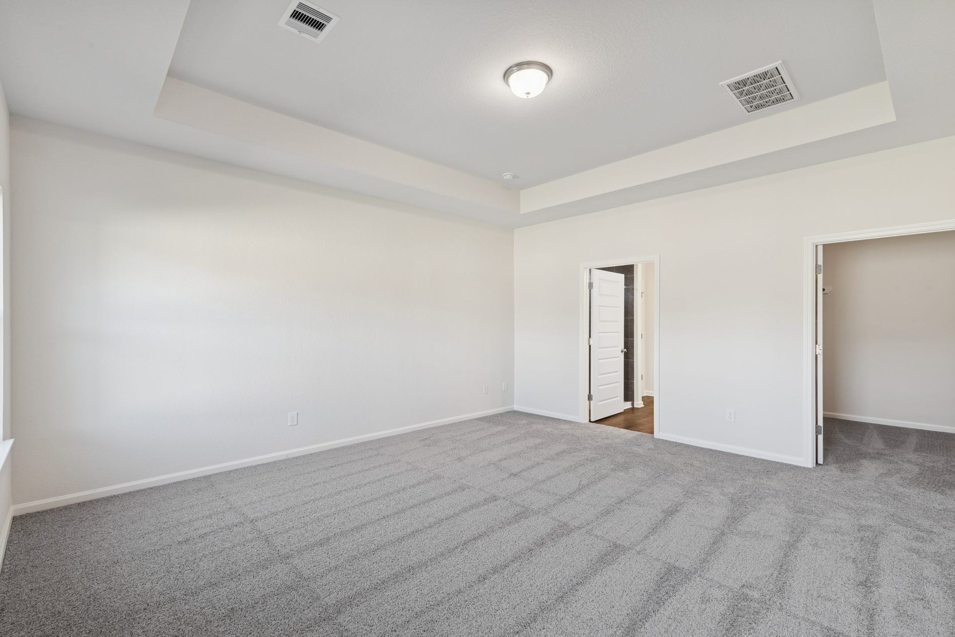 The Crawford- Primary Suite, Tray Ceiling not included. Home under construction, sample photo used for illustrative purposes only, colors and options will vary.