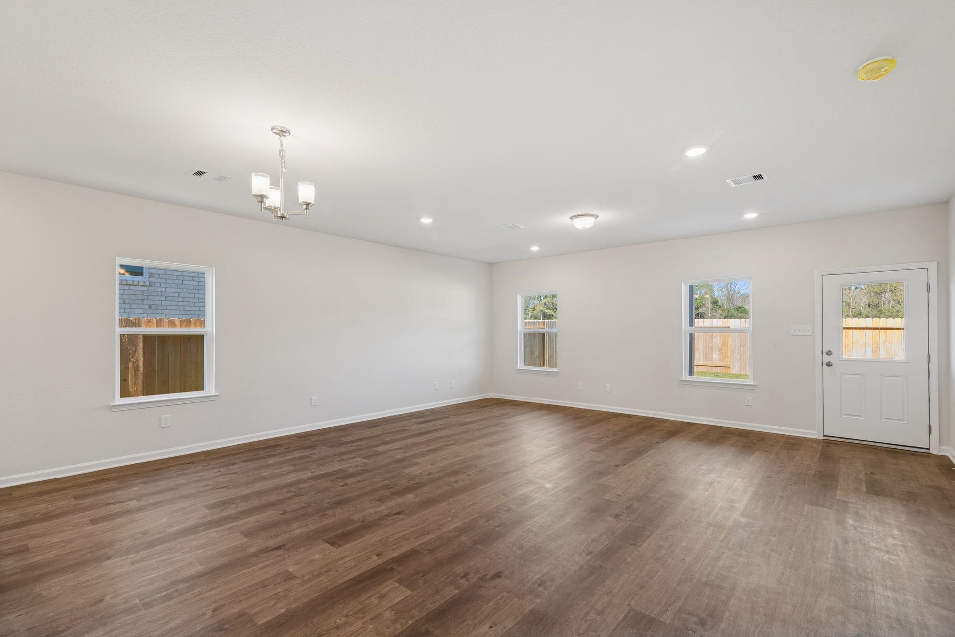 The Crawford- Dining Area and Family Room. Home under construction, sample photo used for illustrative purposes only, colors and options will vary.