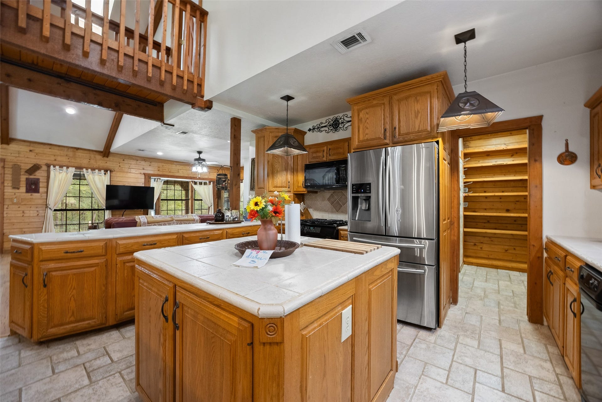 27874 Riley Road, Waller, TX 77484 The beautiful Amish-built cabinetry really shines in this spacious kitchen! A center island adds valuable prep space and storage, while the open layout makes it easy to stay connected with family and friends in the living and dining areas.
