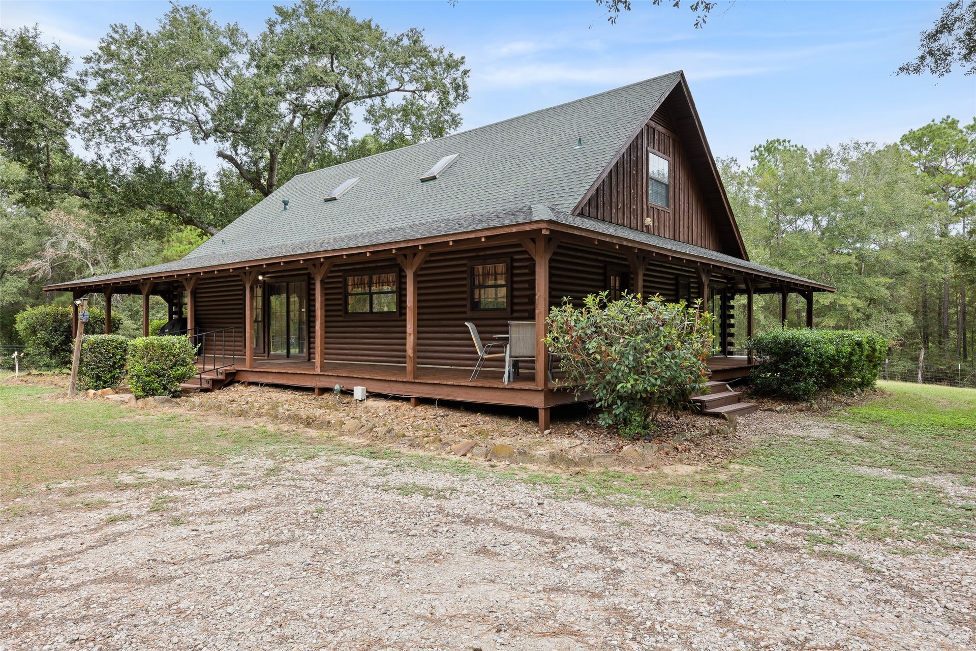 27874 Riley Road, Waller, TX 77484 There's nothing quite like country living! This charming 2-bedroom, 2.5-bath log cabin features a spacious wraparound porch where you can relax, enjoy the fresh air and take in the peaceful surroundings of your own 18+ acres.