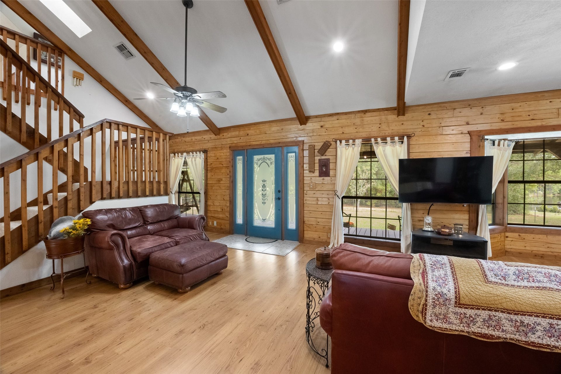 27874 Riley Road, Waller, TX 77484 From the beautiful woodwork and vaulted ceiling to the open staircase and welcoming entry, this family room is full of rustic charm. Generous windows bring the outdoors in, making it easy to enjoy the country setting from the comfort of home.