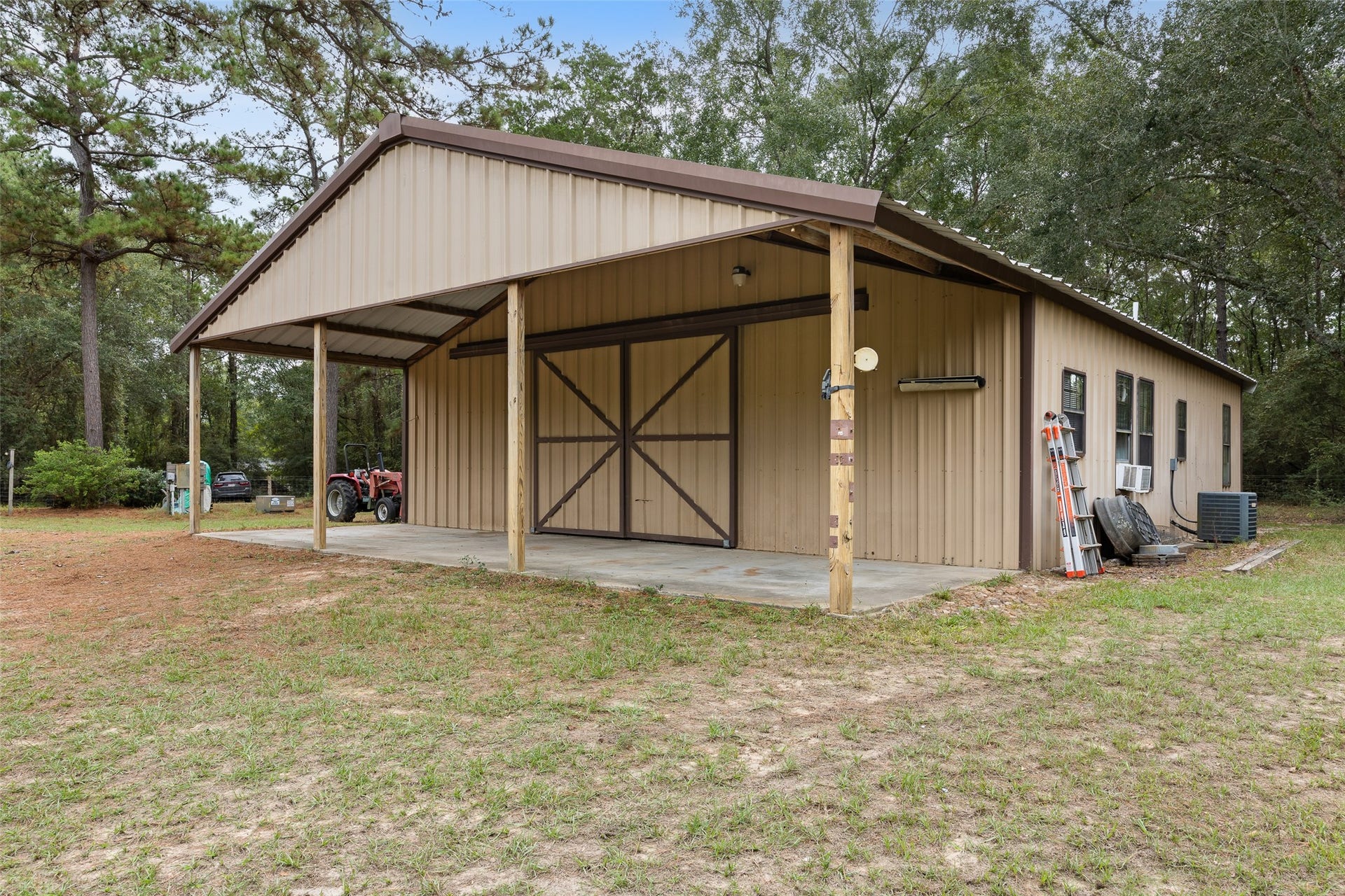27874 Riley Road, Waller, TX 77484 The barn's covered front area provides convenient shelter for equipment and outdoor projects, while the enclosed interior offers additional space for storage and hobbies.
