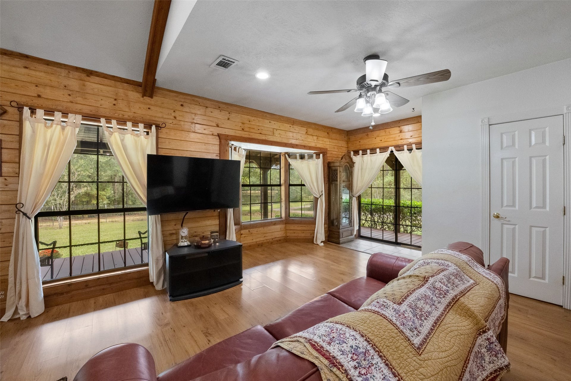 27874 Riley Road, Waller, TX 77484 Beautiful bay windows bring in natural light and peaceful country views, while warm wood walls and wood-look laminate flooring add to the cabin's charm. It's a comfortable place to relax, unwind and enjoy the slower pace of country living.