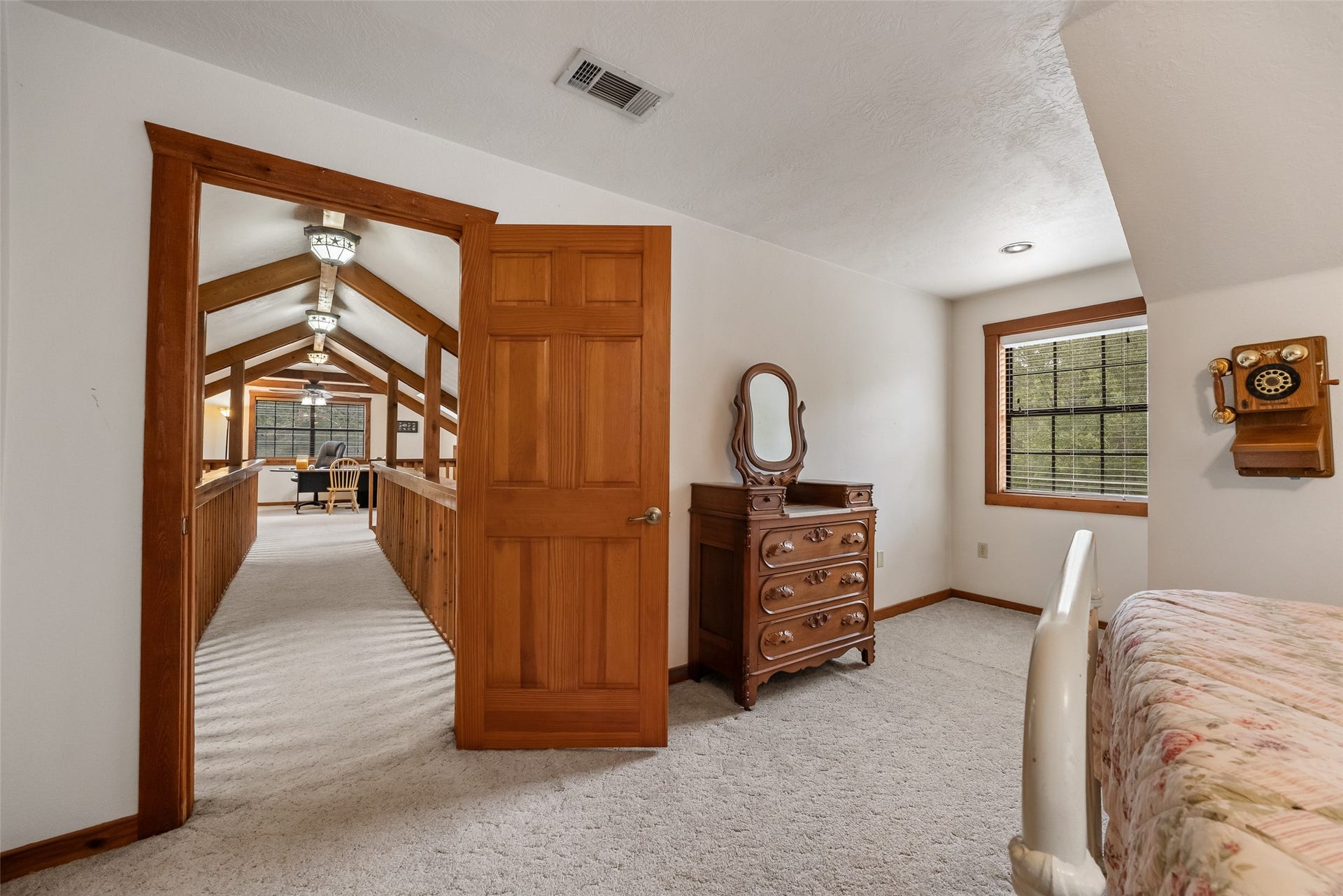 27874 Riley Road, Waller, TX 77484 Tucked away from the main living areas, this spacious guest bedroom offers a quiet, comfortable retreat with easy access to the loft and upstairs full bathroom.