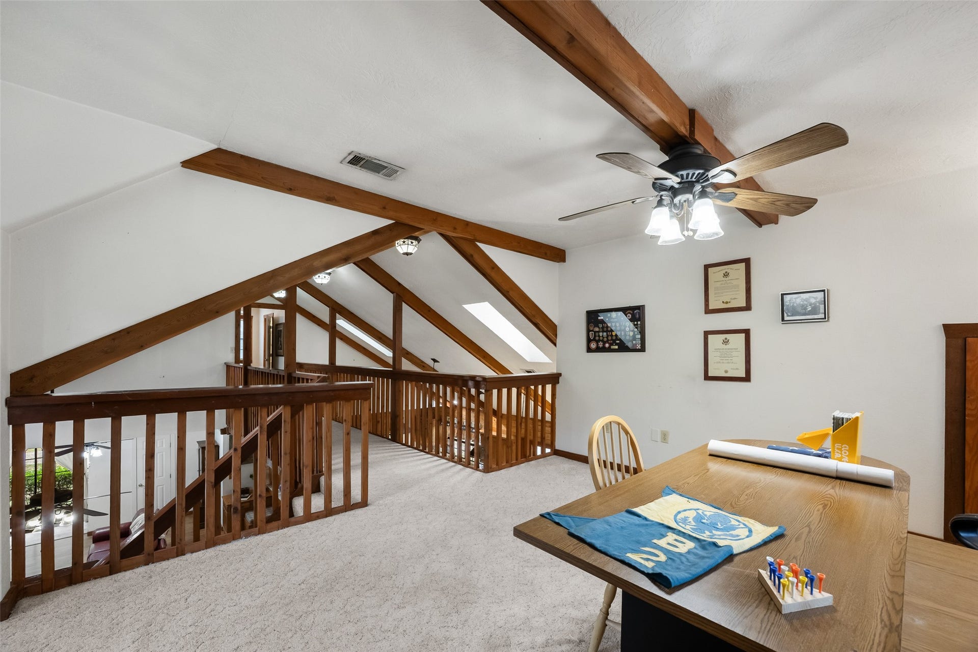 27874 Riley Road, Waller, TX 77484 From this angle, you can appreciate the open design of the upstairs loft, with exposed wood beams, vaulted ceilings and a charming overlook to the living area below. This flexible space offers plenty of possibilities to fit your lifestyle.