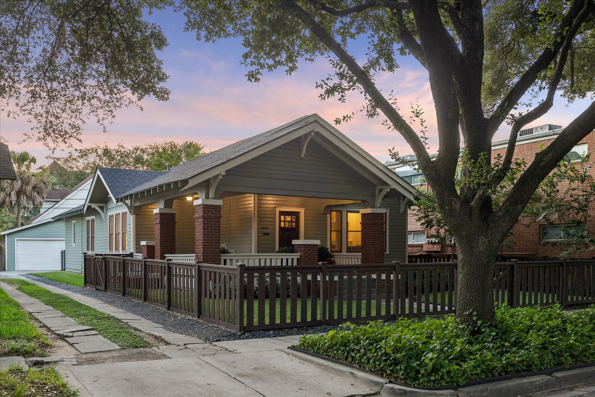 1635 Harvard Street, Houston, TX 77008 This amazing 1920s bungalow features mature trees and a fully fenced front yard with main gate facing the street and side gate accessing the driveway.