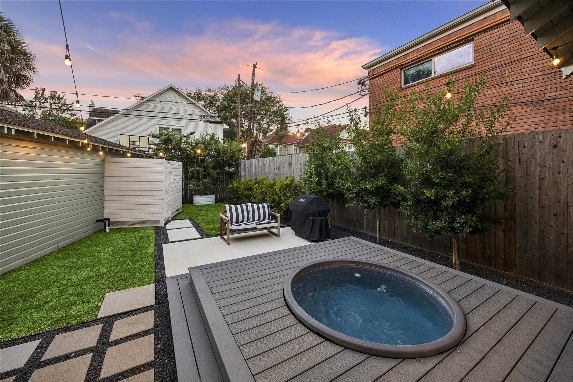 1635 Harvard Street, Houston, TX 77008 Meticulously landscaped, this backyard layout makes the most of the space with the extended porch featuring the above ground "cowboy pool" (with filter & temp control. All equipment conveys), as well as the outdoor shower.