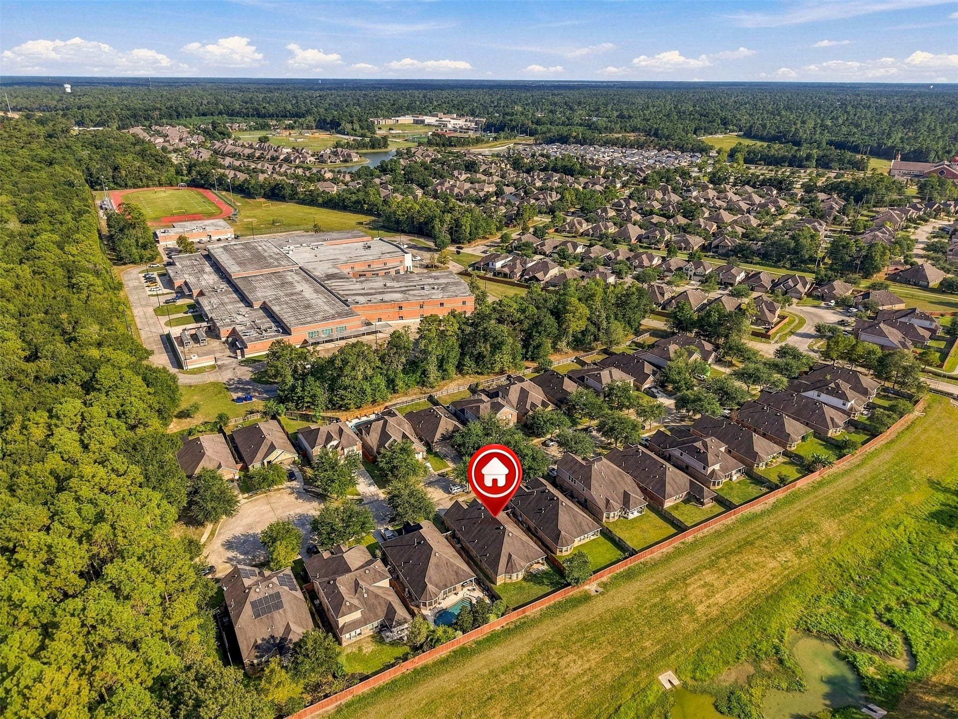 4557 Argonne Woods Drive, Porter, TX 77365 Charming home nestled in a serene neighborhood, surrounded by lush greenery and close to local amenities, offering a peaceful suburban lifestyle.
