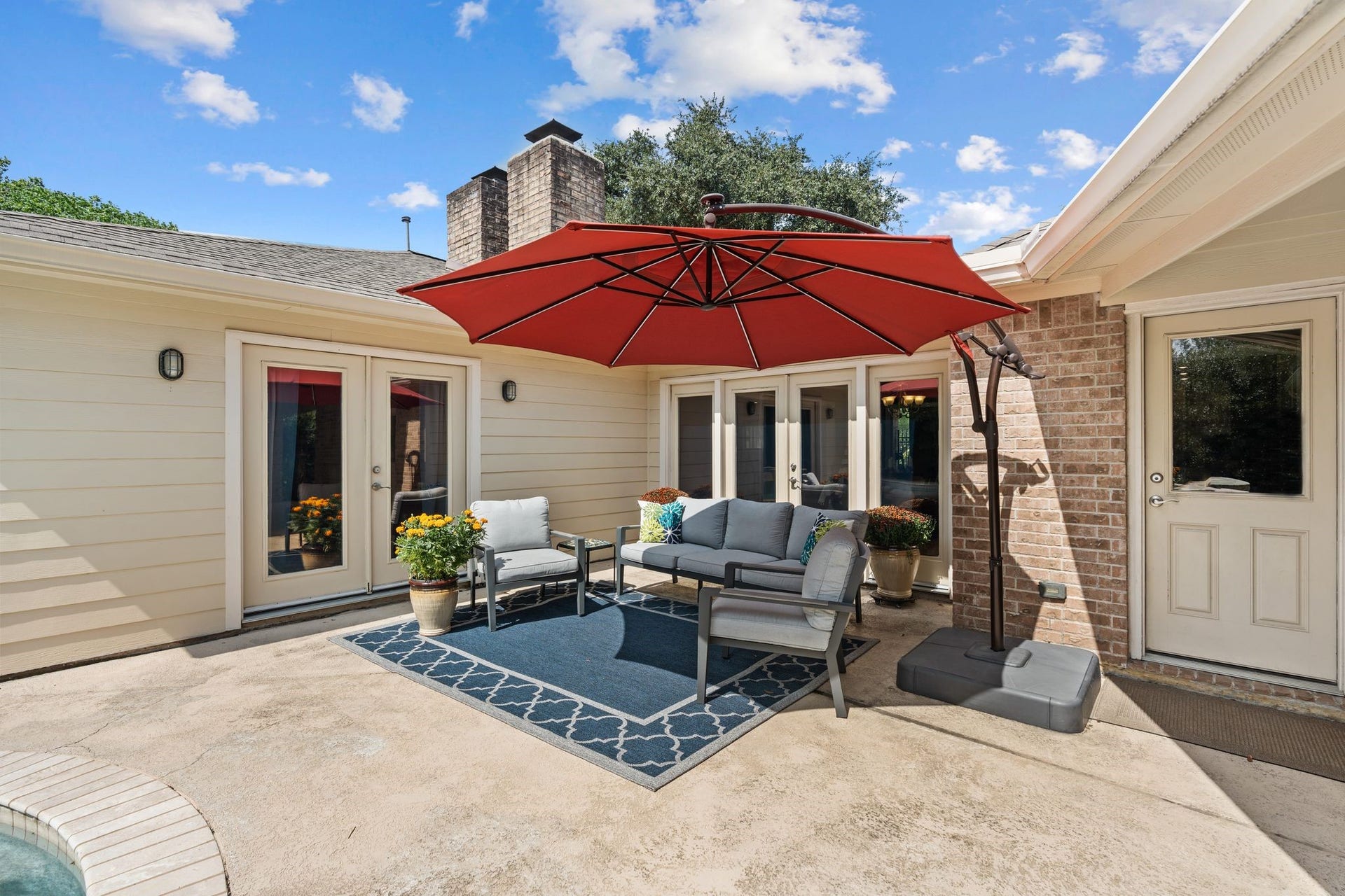 11519 Lakeside Place Drive, Houston, TX 77077 Charming outdoor patio surrounded by lush greenery.