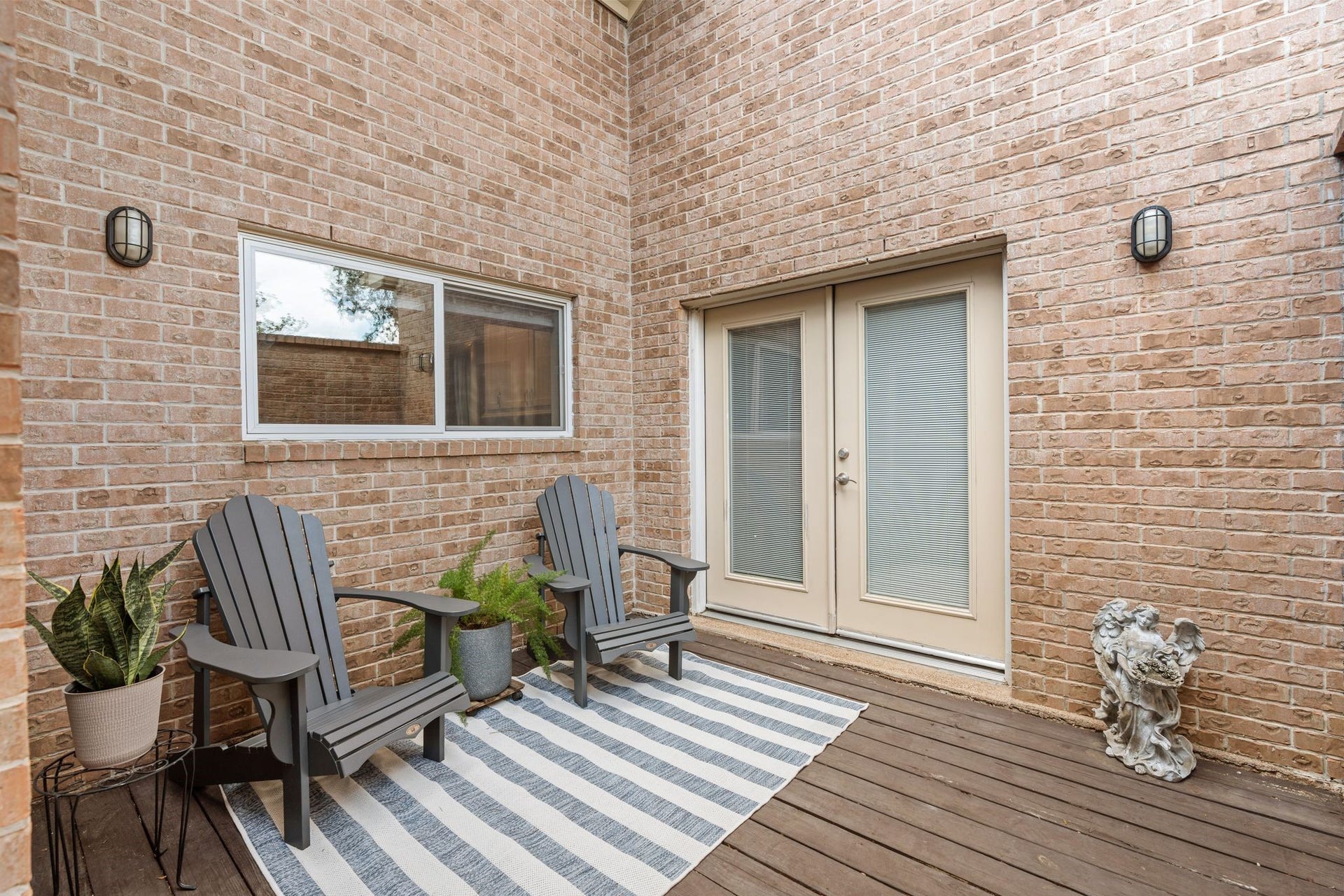 11519 Lakeside Place Drive, Houston, TX 77077 Private patio with elegant brick walls, perfect for relaxing.
