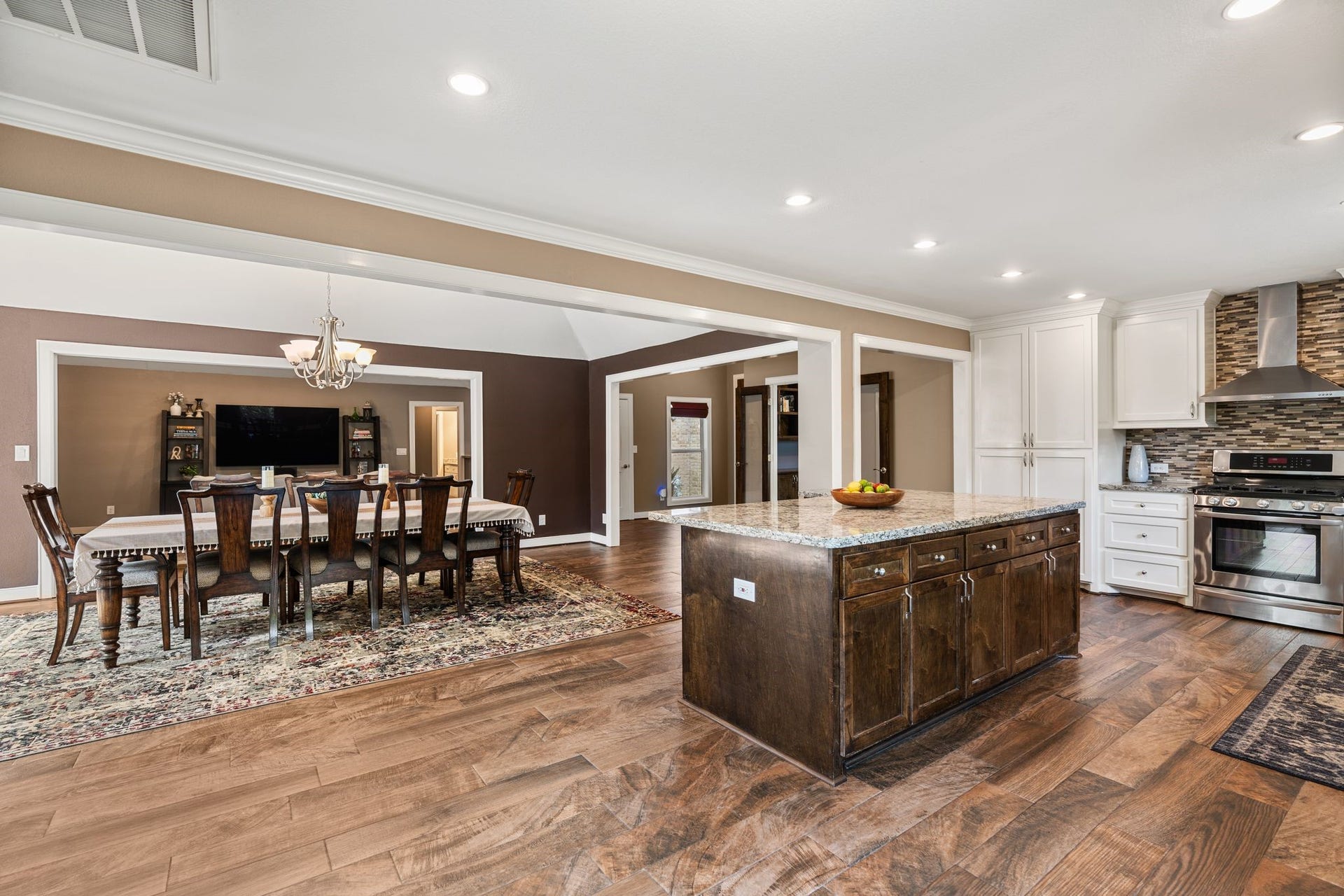 11519 Lakeside Place Drive, Houston, TX 77077 Spacious open-concept kitchen and dining area featuring a large island, stainless steel appliances, and ample cabinetry.