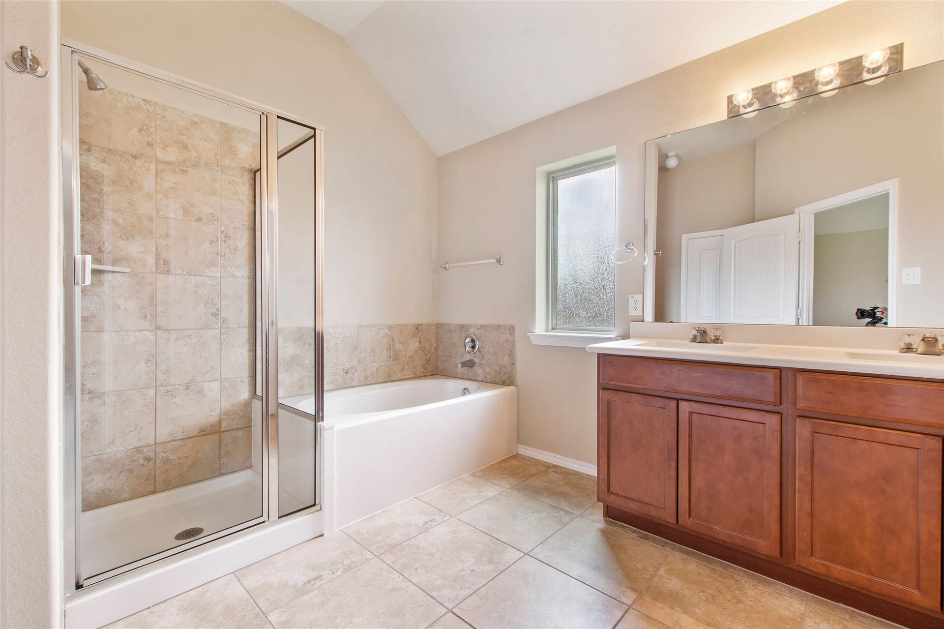 8746 Sunny Gallop Drive, Tomball, TX 77375 En Suite primary bathroom is spacious with shower, soaking tub, and double sink/vanity area. Attached is a very large walk in closet.