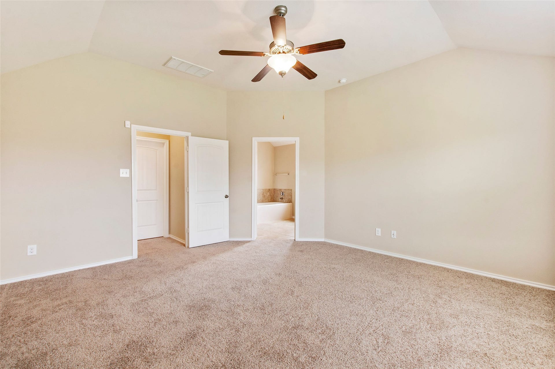 8746 Sunny Gallop Drive, Tomball, TX 77375 The primary suite is separate from the secondary bedrooms to allow maximum privacy. It's large enough to hold a king sized bed, 2 nightstands, dresser with mirror and a chest of drawers.