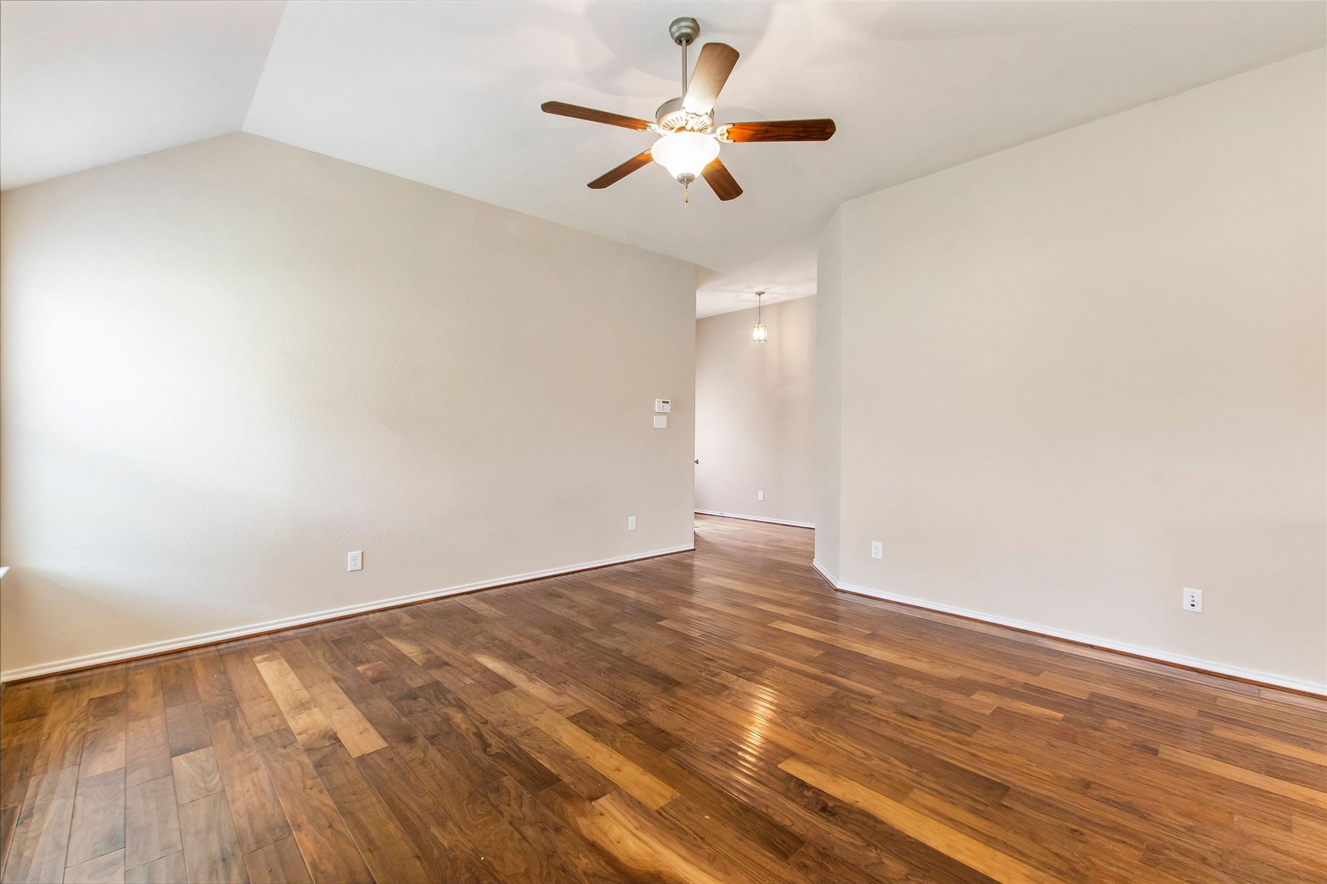 8746 Sunny Gallop Drive, Tomball, TX 77375 Alternate view of the family room standing from the kitchen area. The front door and two secondary bedrooms with bathroom are at the front of the house.