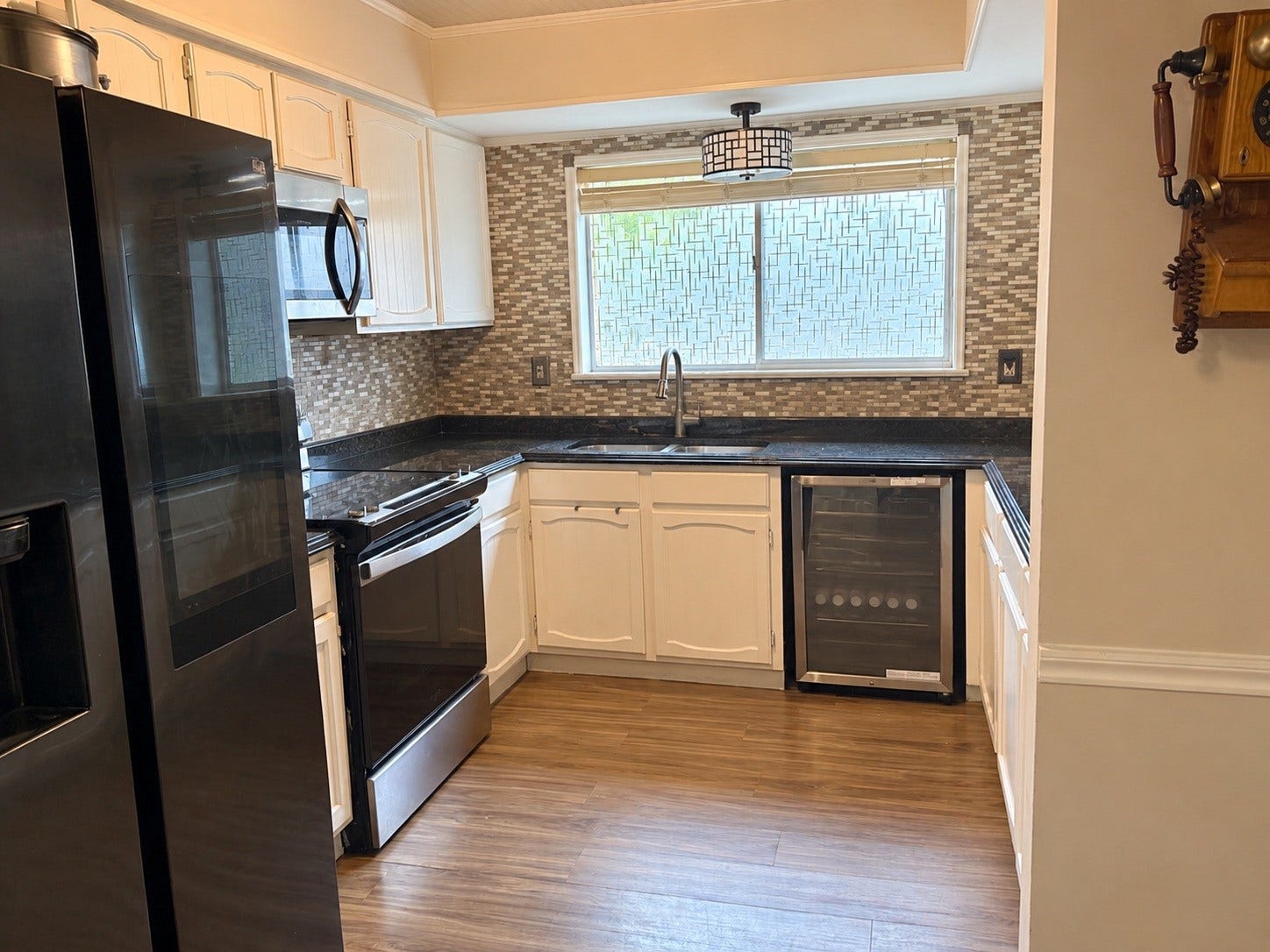 Kitchen- Digitally enhanced to remove personal items and countertop clutter.