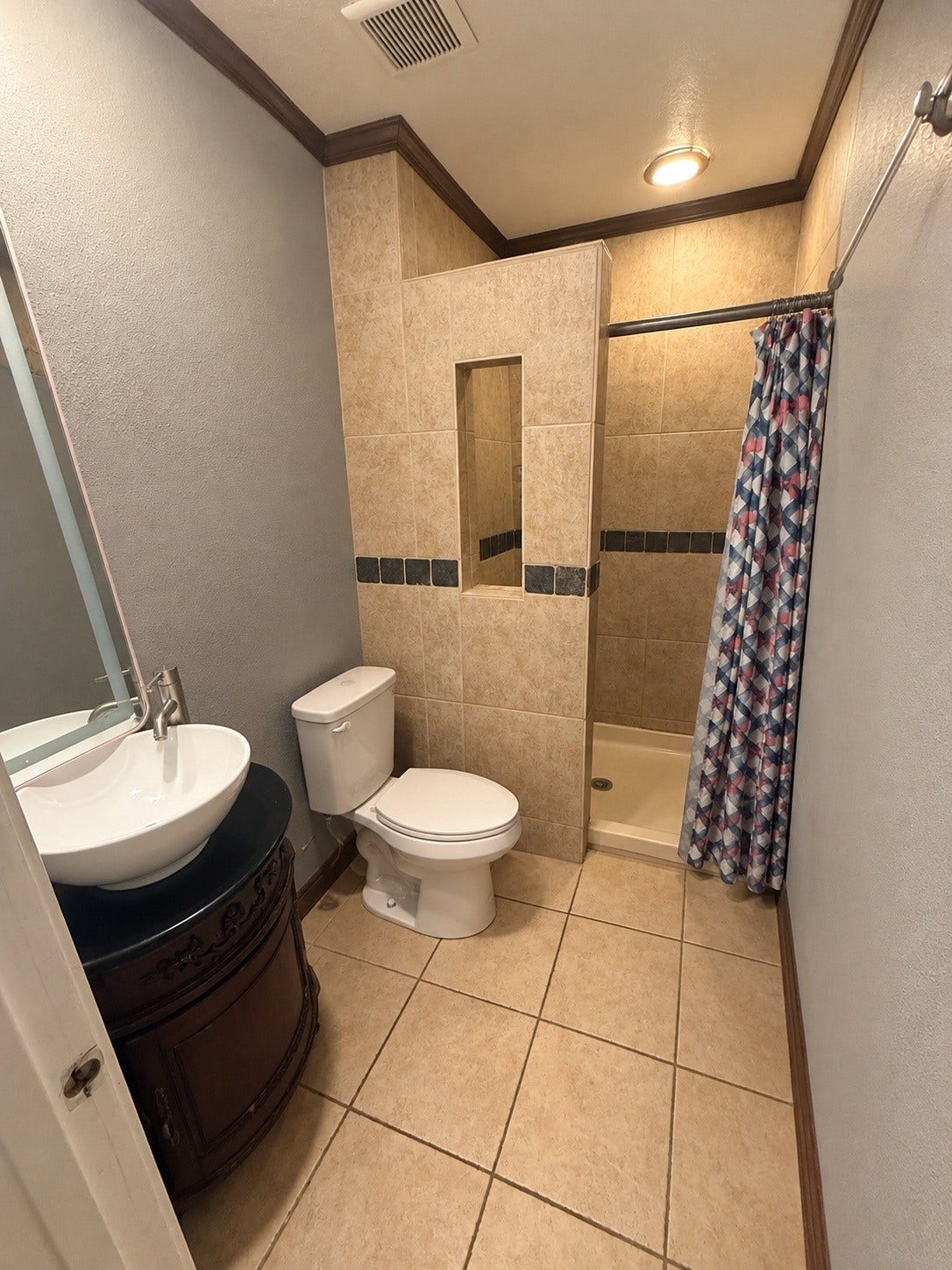 Primary bath-Digitally enhanced to remove personal items and decor.
