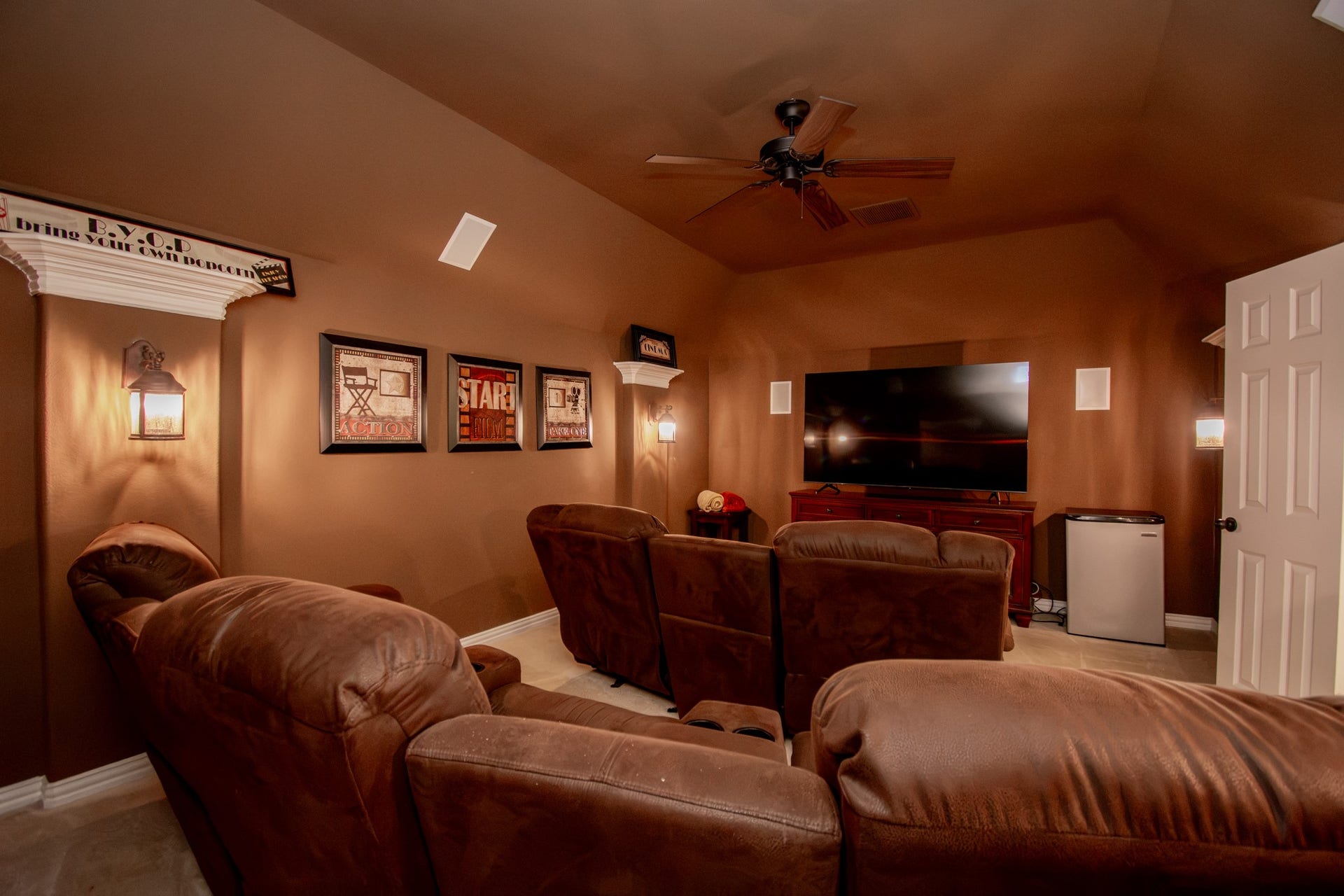 Beautiful media room with custom recliners are perfect for watching movies or just chilling.