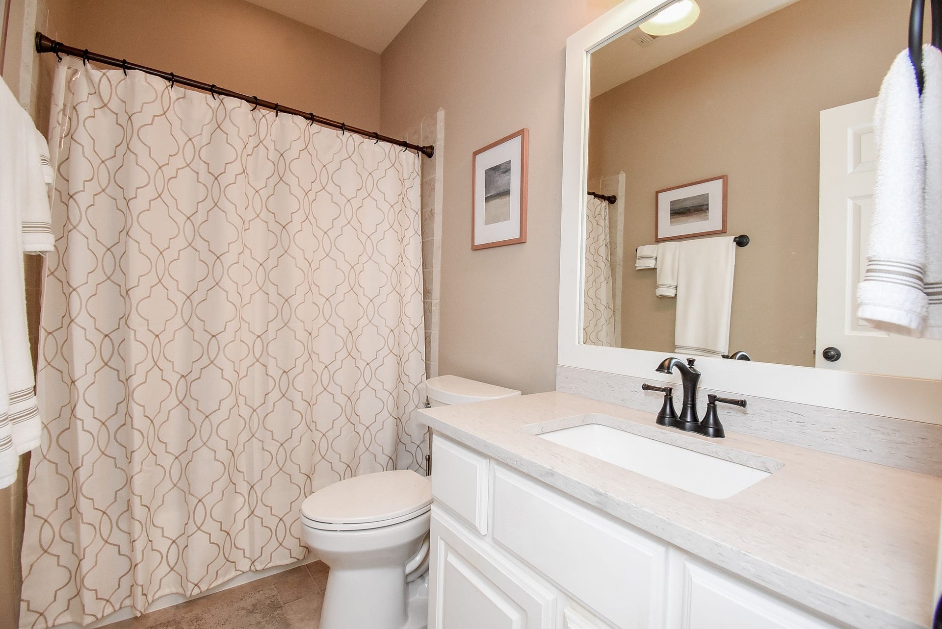 Downstairs full bath (tub and shower) just off secondary bedroom