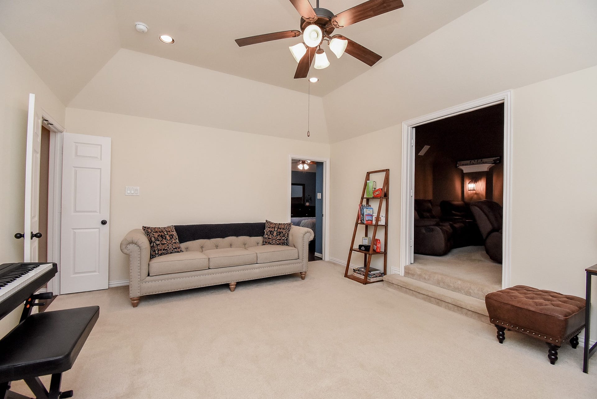 Game room/quiet space or whatever additional space you need with tray ceiling and fan leading into media room.