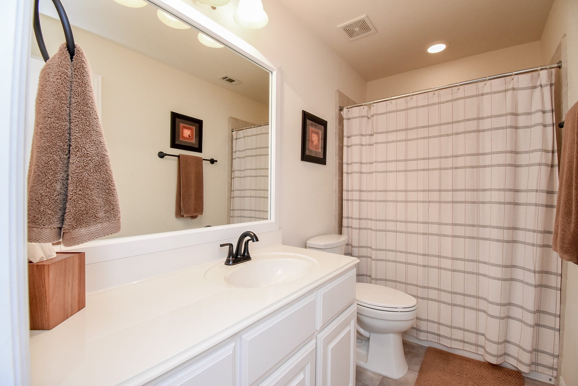 Secondary full bath upstairs that serves bedroom as well as gameroom and media room.