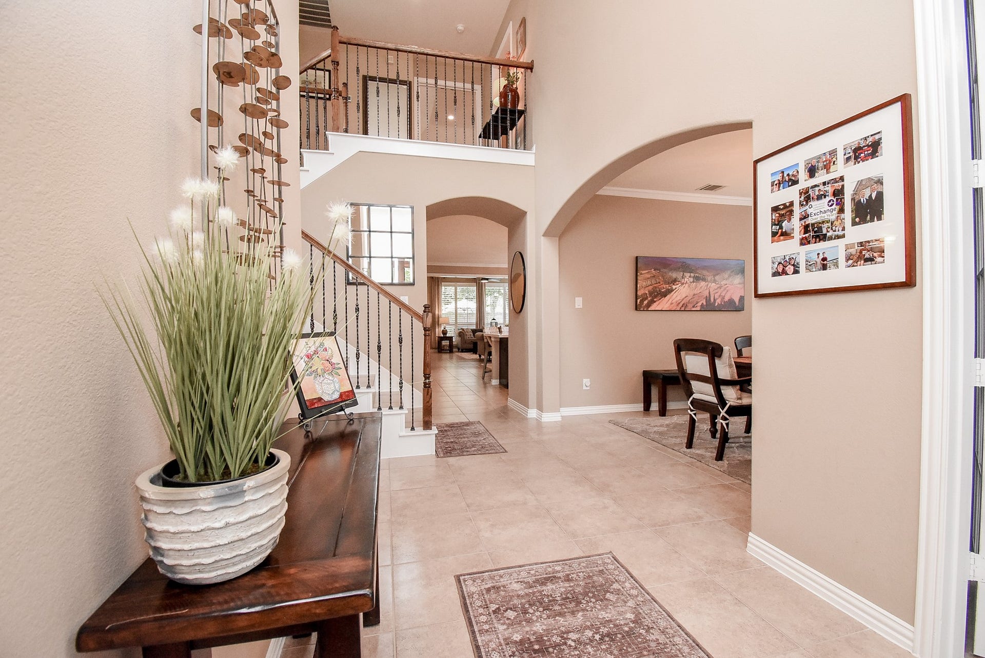 Inside foyer view looking back with high ceiling.